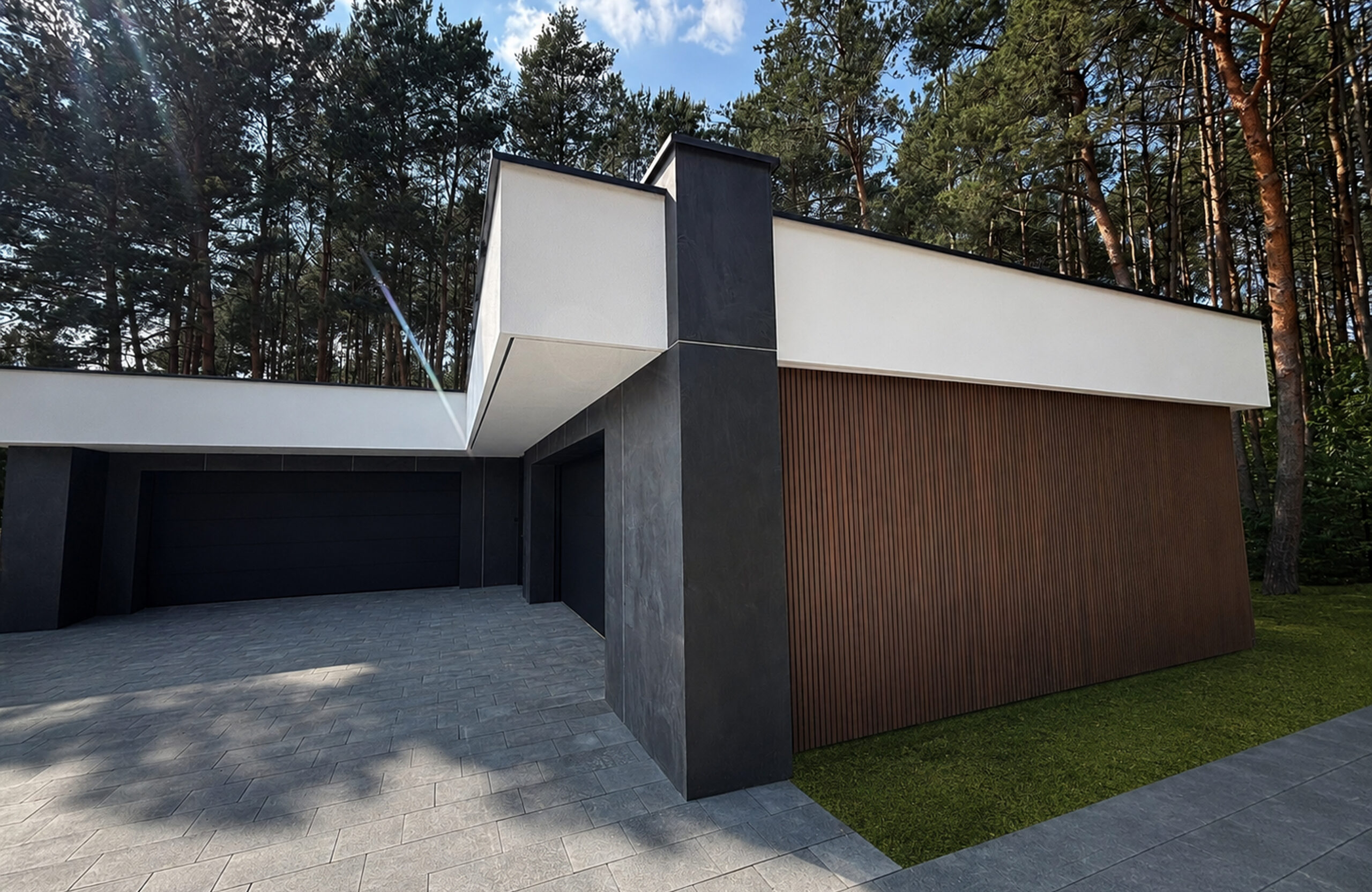 Modern contemporary house exterior with white and charcoal walls, a wooden slat screen, and a forest of tall trees behind.