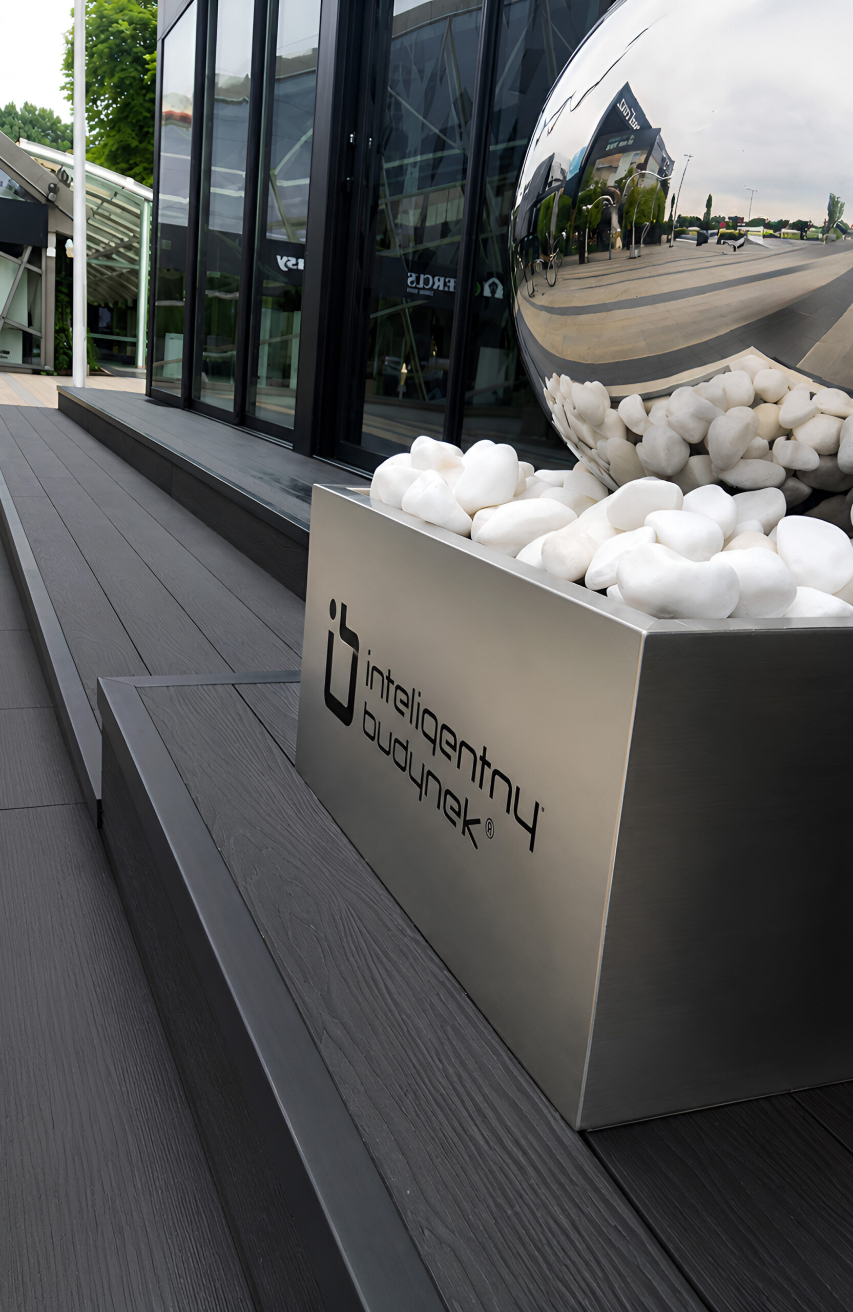 Bruggan Elegant Anthracite decking at a modern commercial building entrance