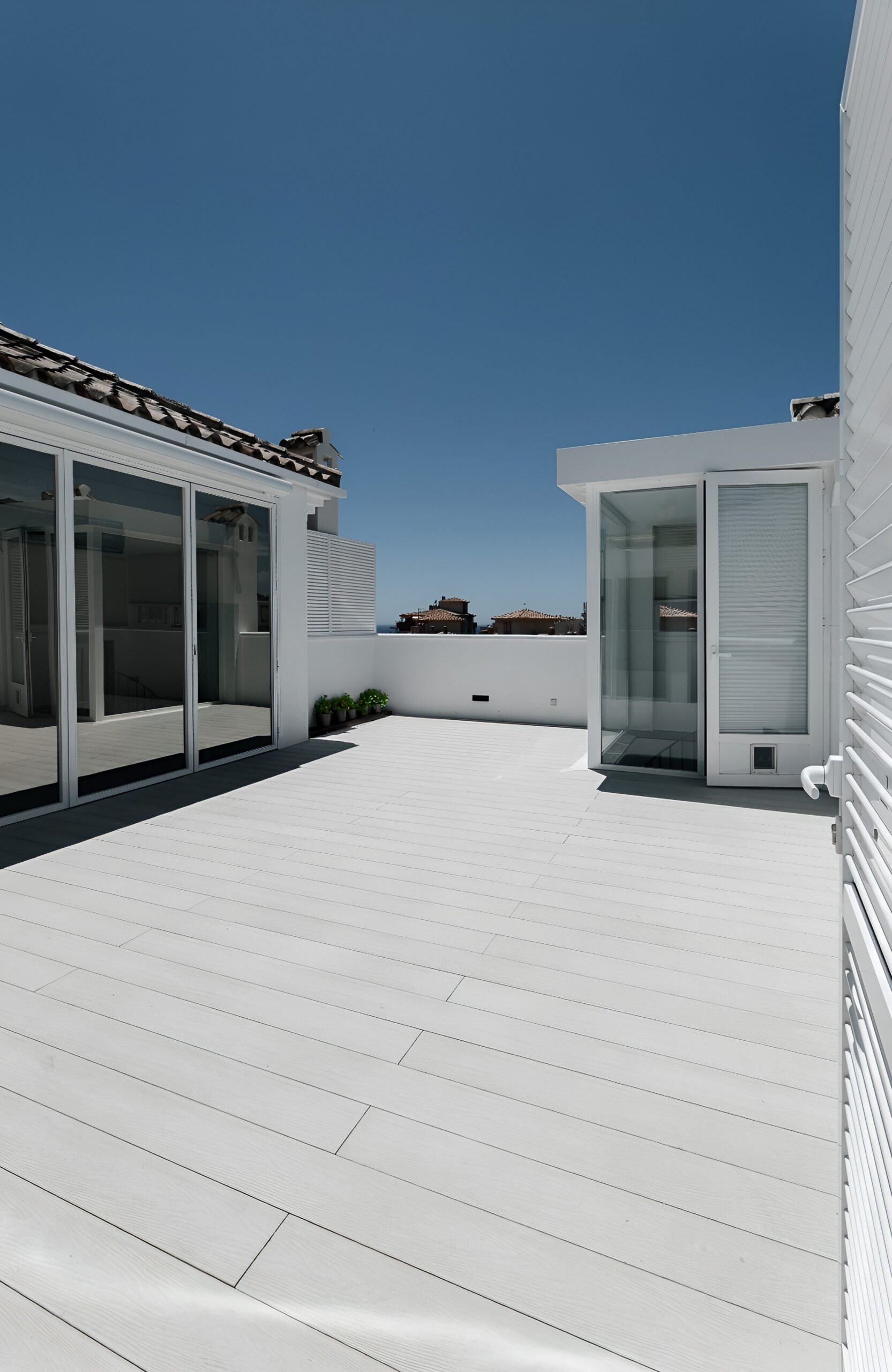 Bright rooftop terrace finished with Bruggan Elegant Cream Latte composite decking