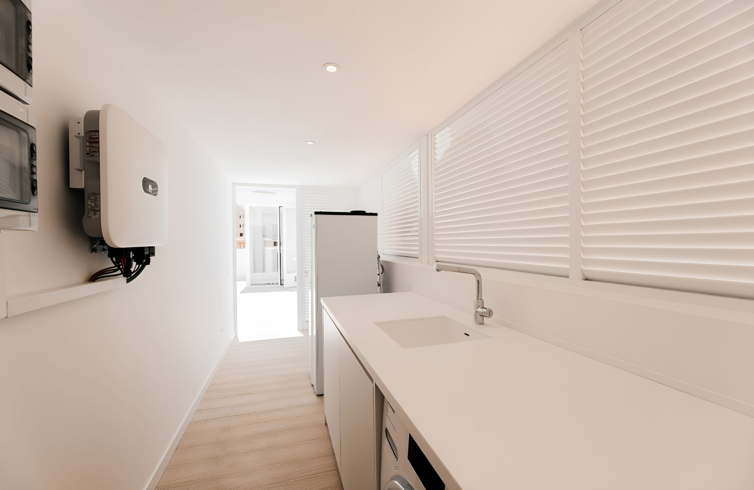 Bruggan Elegant Cream Latte decking used in a bright modern utility room