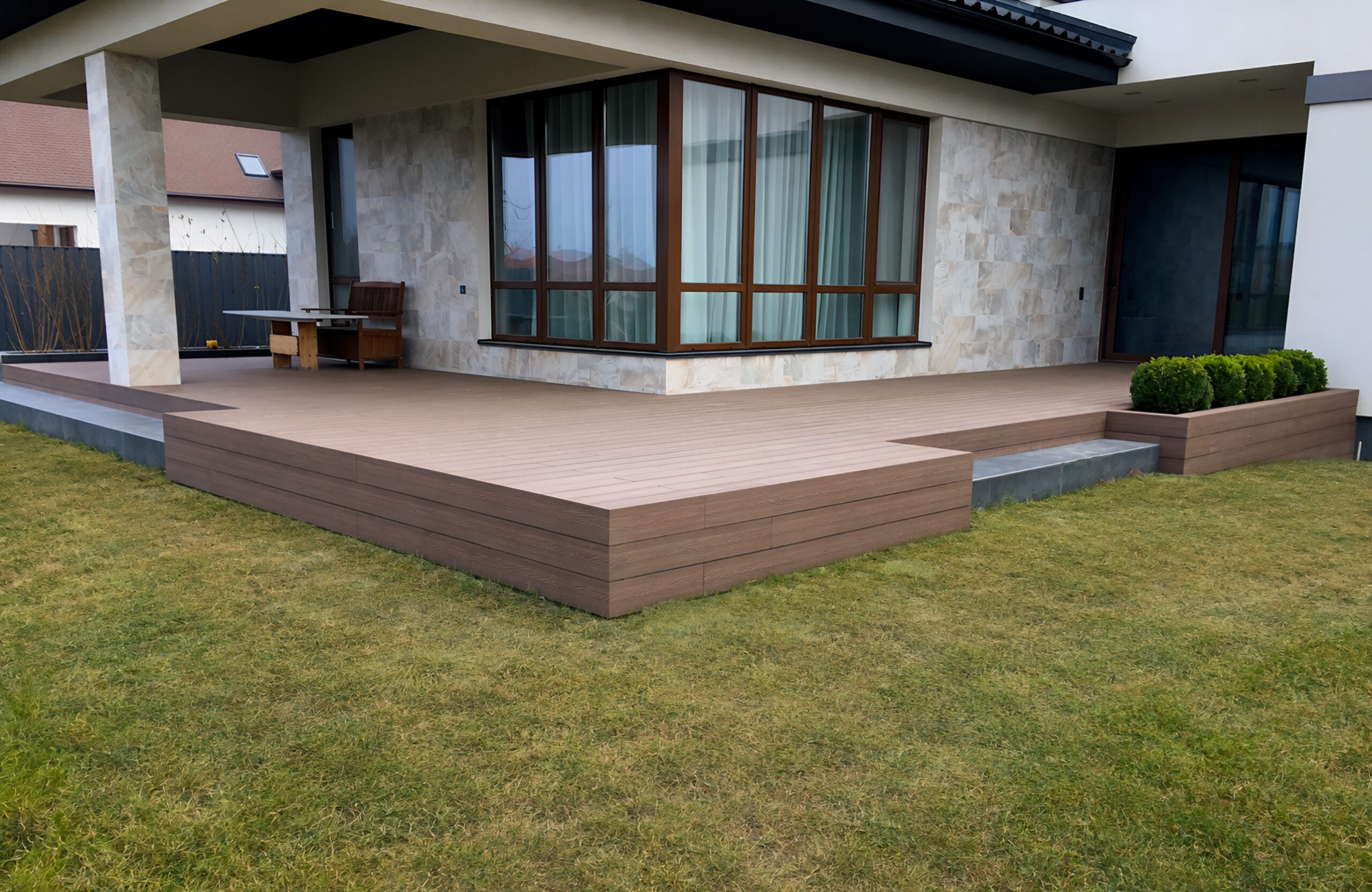 Bruggan Elegant Wine Brown composite decking terrace around a modern private house