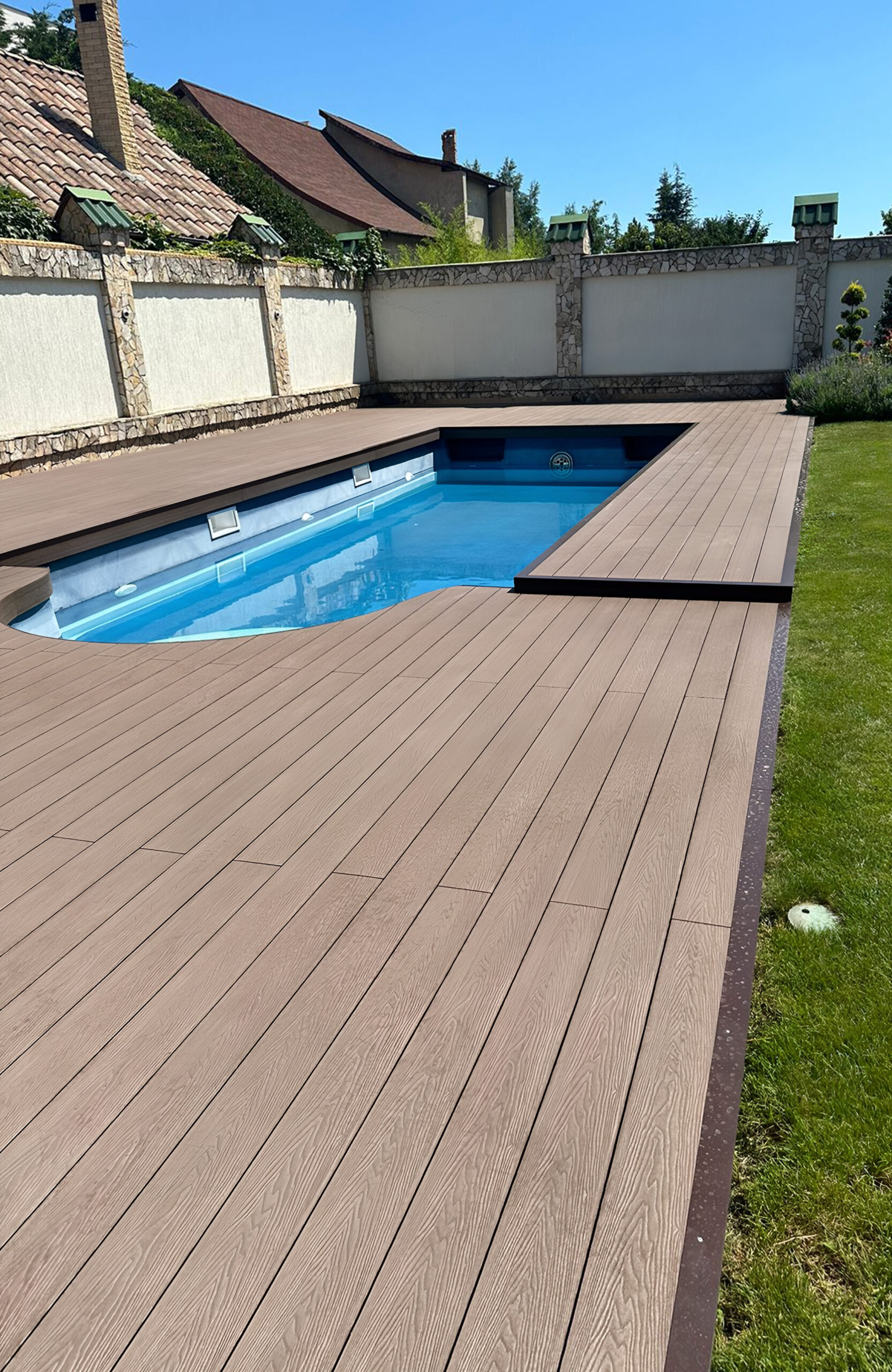 Bruggan Elegant Wine Brown composite decking surrounding a private outdoor swimming pool and landscaped garden