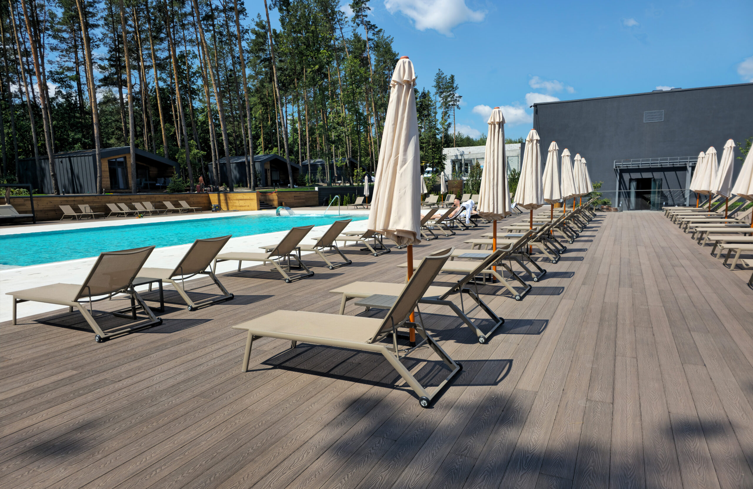 Bruggan Elegant Wine Brown decking around the swimming pool at Riverwood Relax Park, Cherkasy Oblast, Ukraine