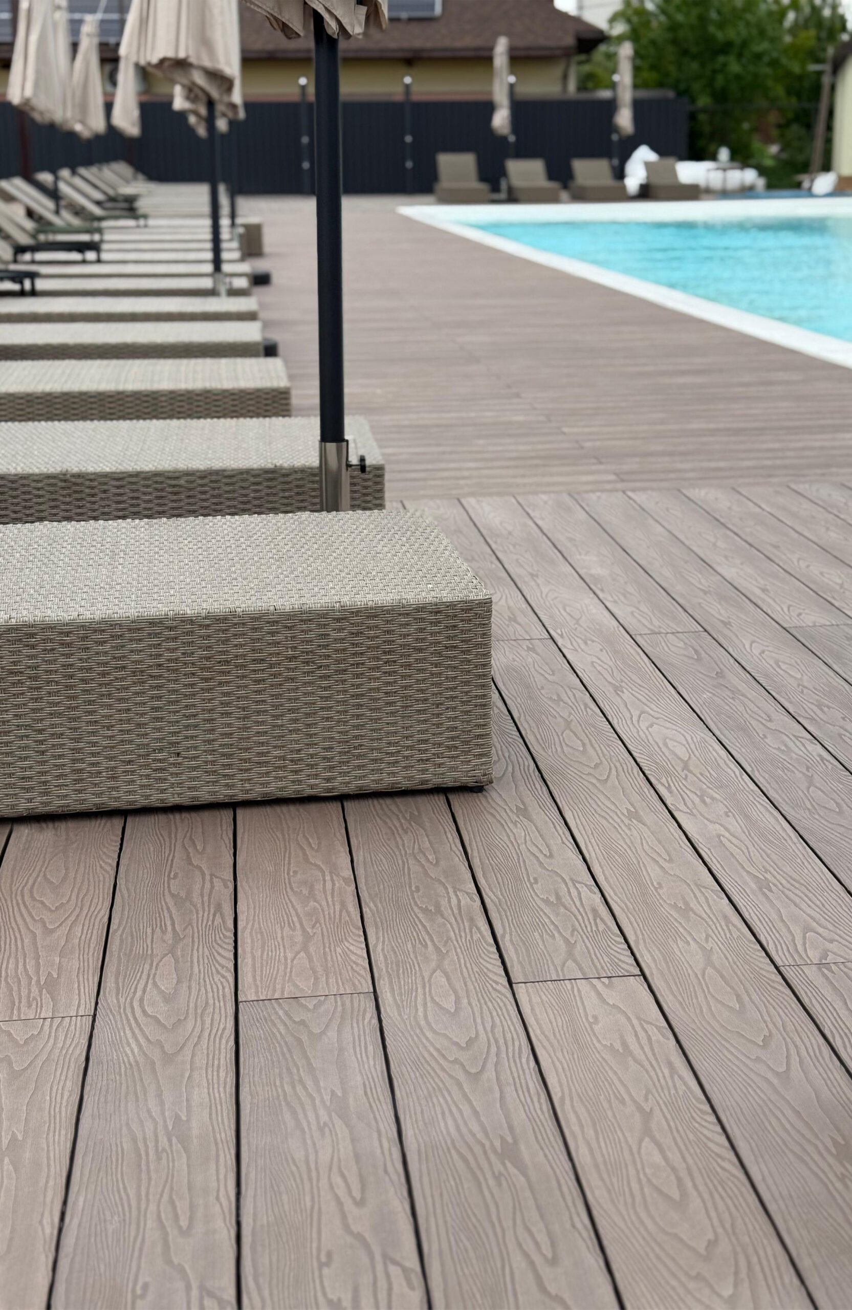Bruggan Elegant Wine Brown pool decking with sun loungers at Bilohorodski Lazni in Kyiv Oblast