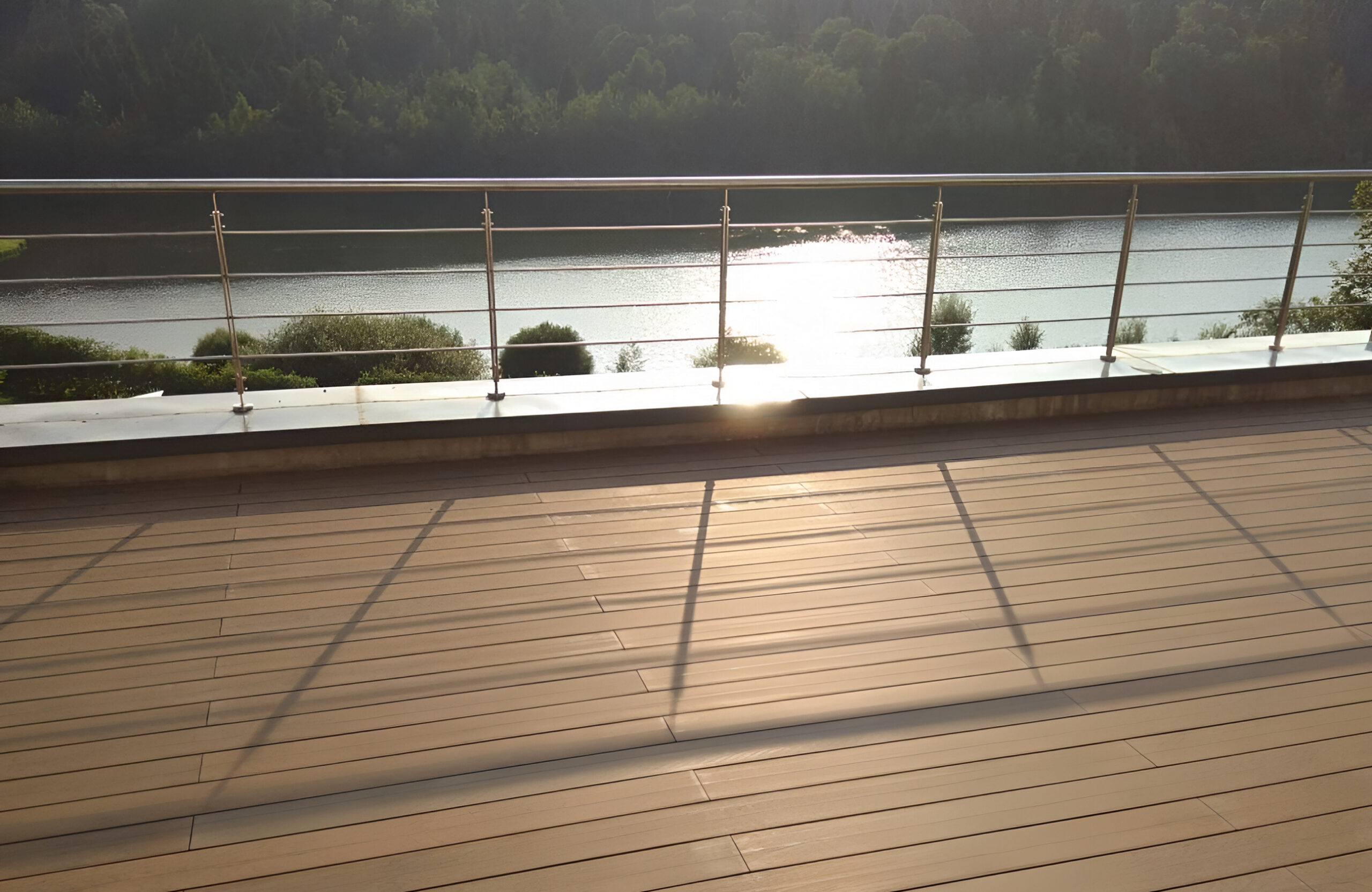 Bruggan Multicolor Cedar composite decking on a terrace overlooking a lake