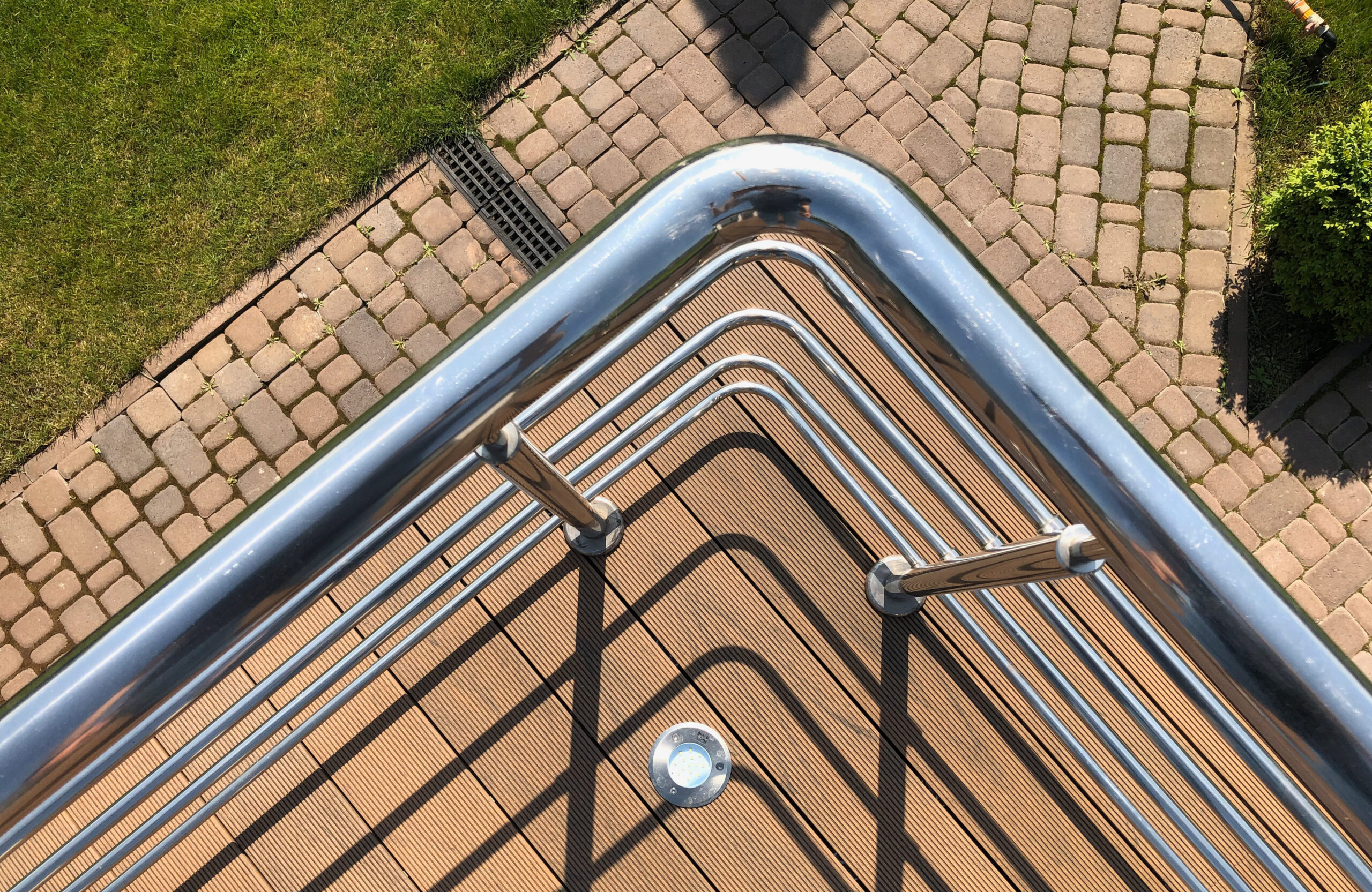 Bruggan Multicolor Cedar composite decking around a private outdoor swimming pool