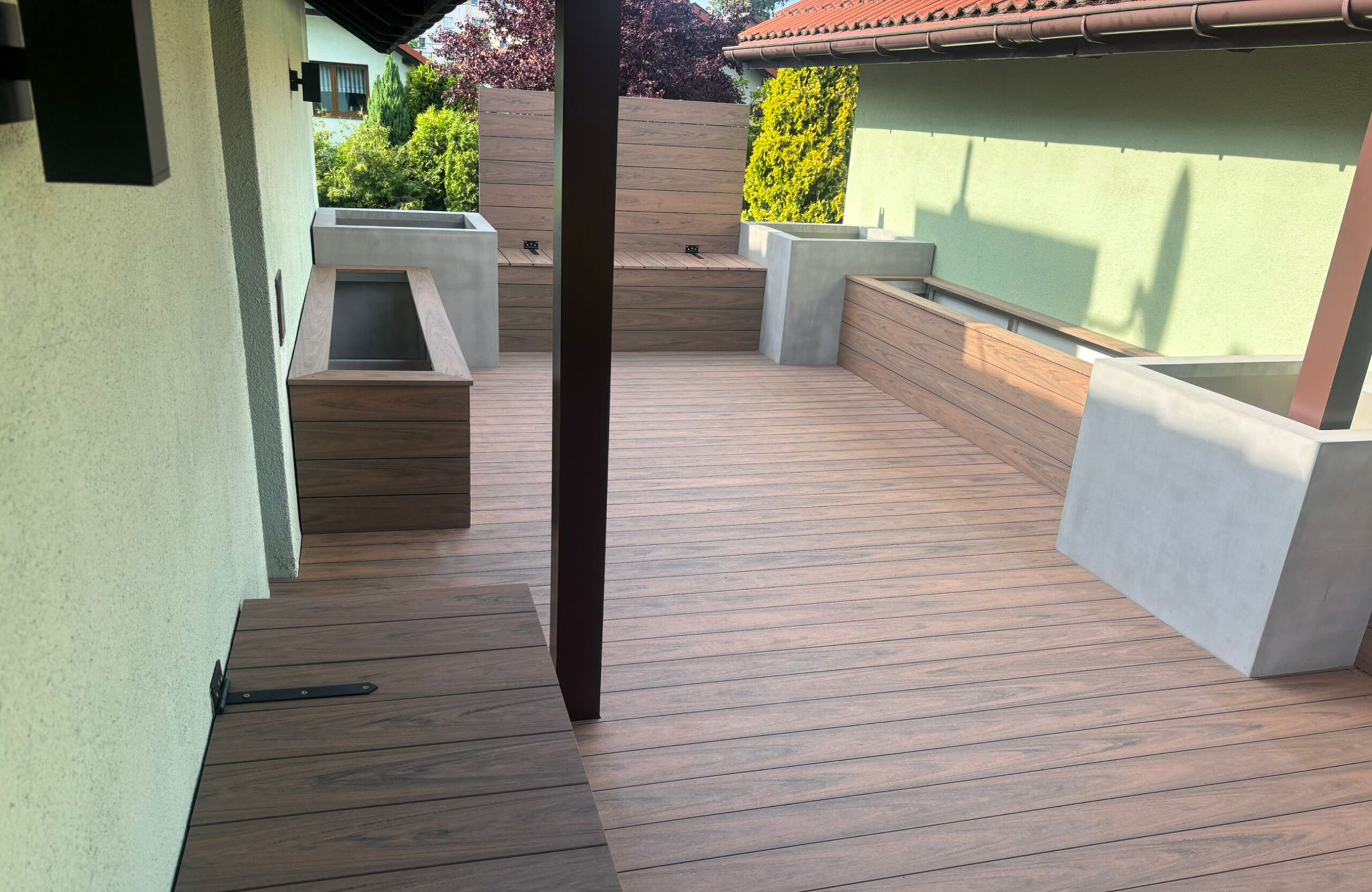 Bruggan Multicolor Cedar composite decking with integrated planters and wall cladding