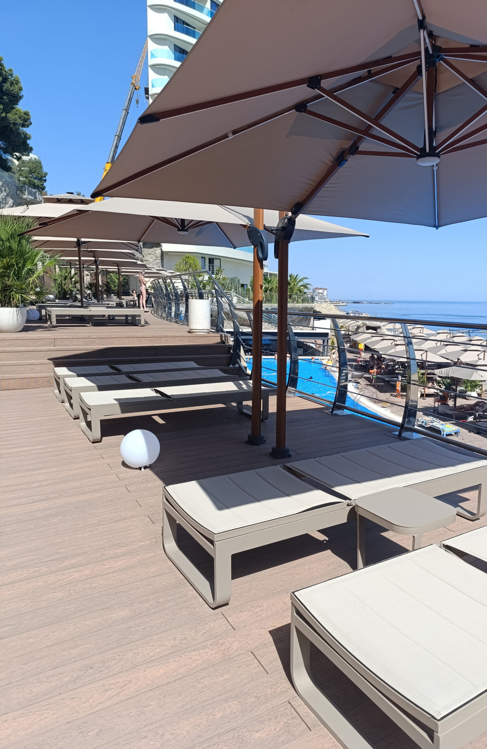 Close-up of Bruggan Multicolor Cedar composite decking on a luxury seaside terrace