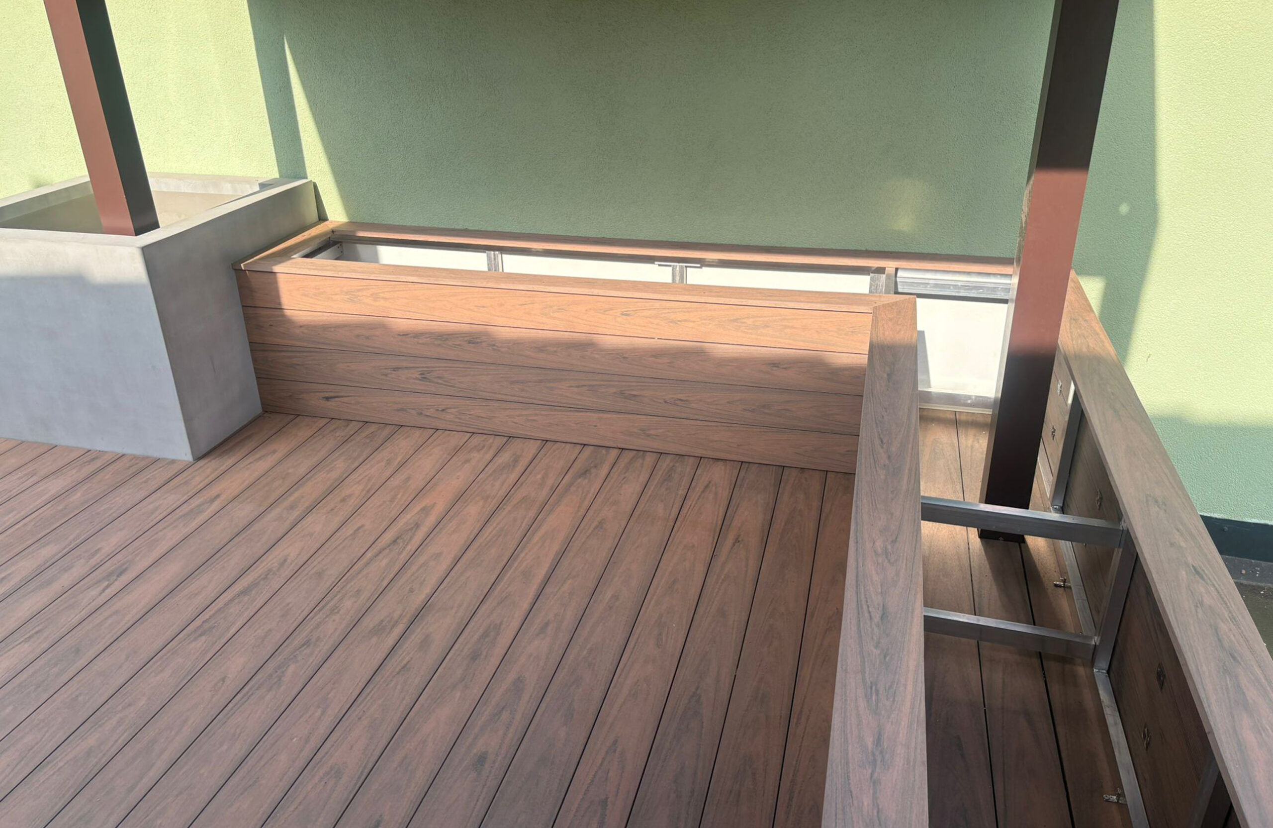 Close-up of Bruggan Multicolor Cedar decking and custom composite terrace cladding