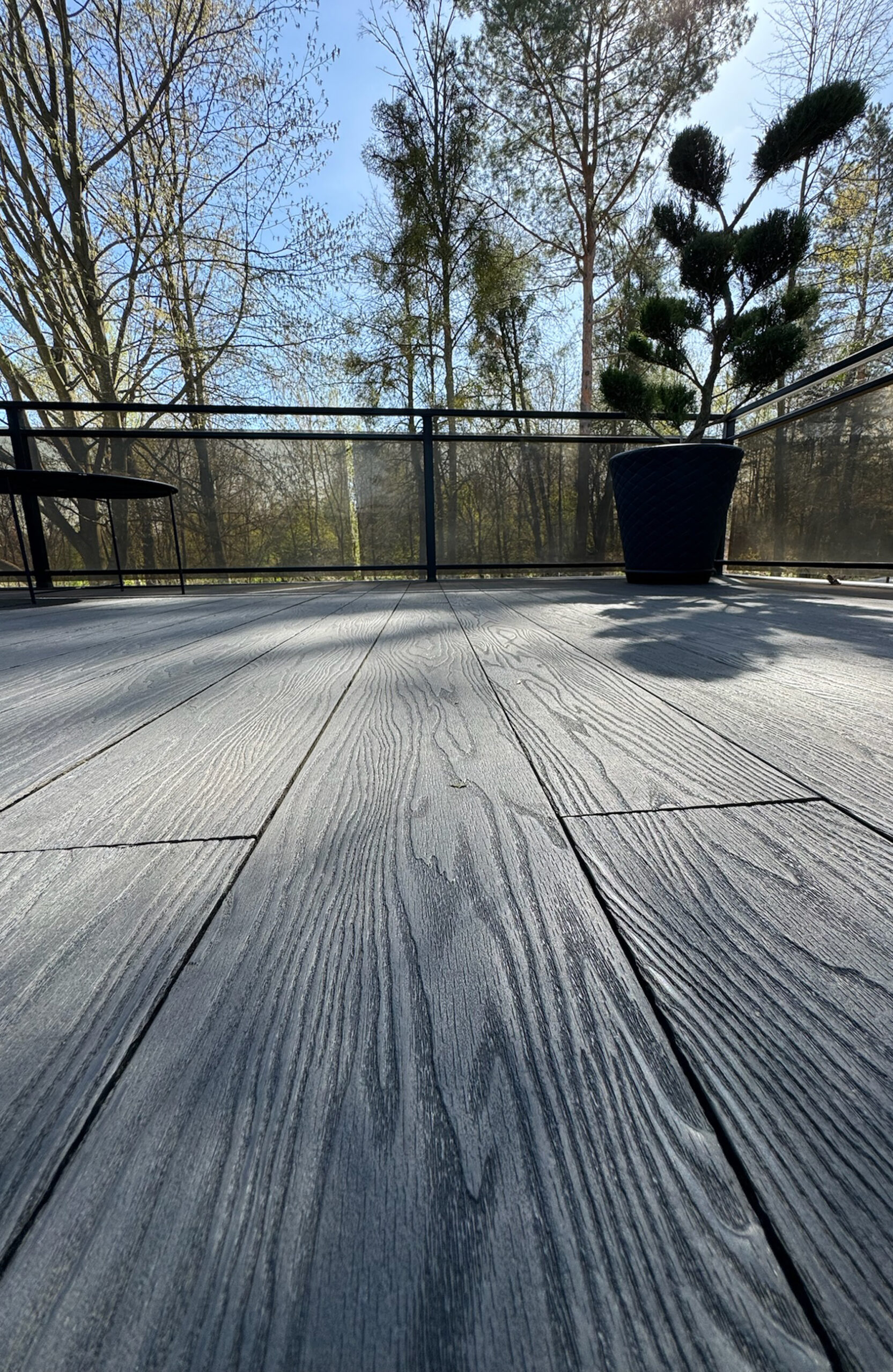 Close-up of anthracite composite decking with realistic wood grain texture