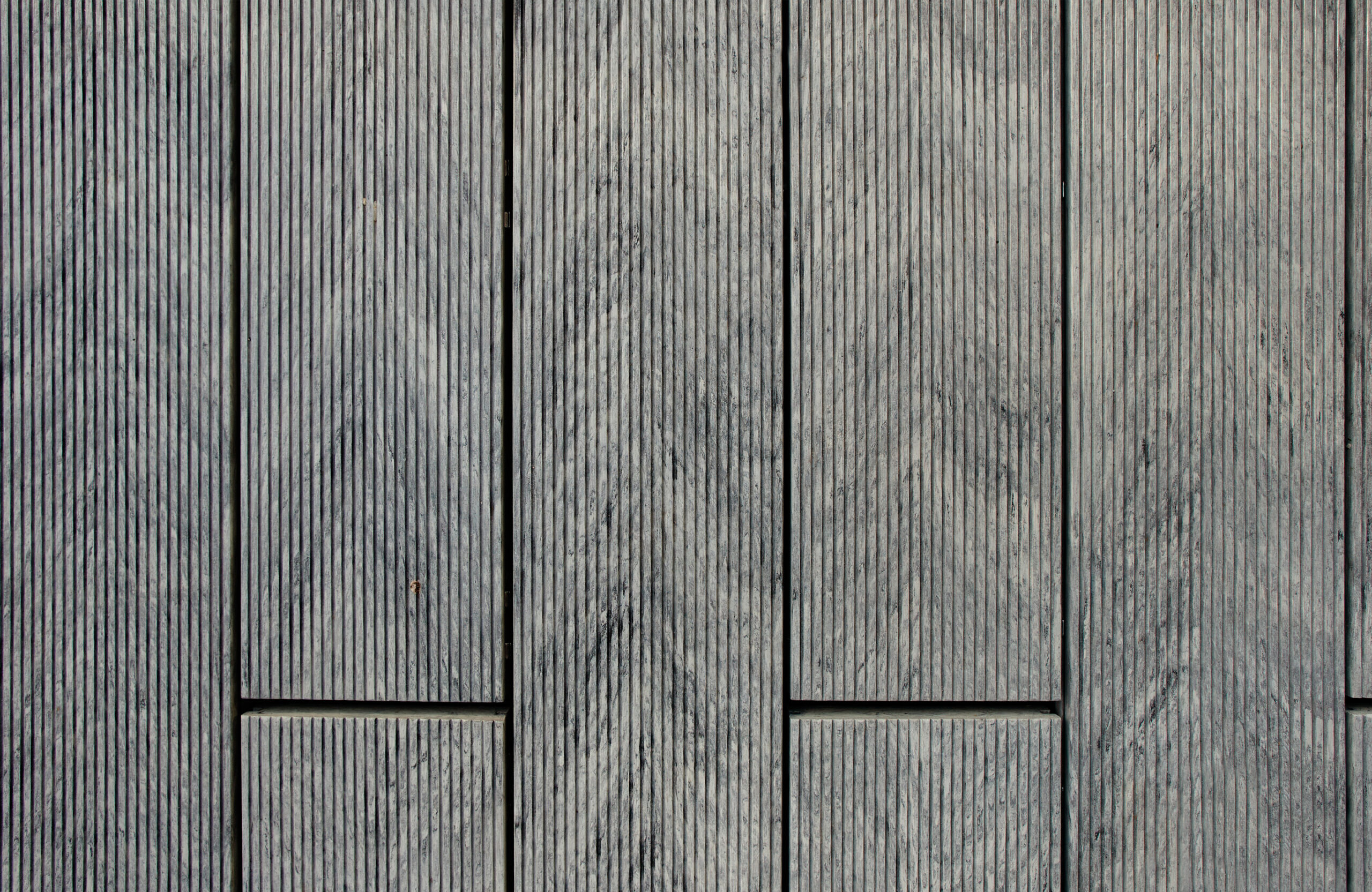 Grey BRUGGAN Multicolor composite decking with a grooved surface for modern outdoor terraces