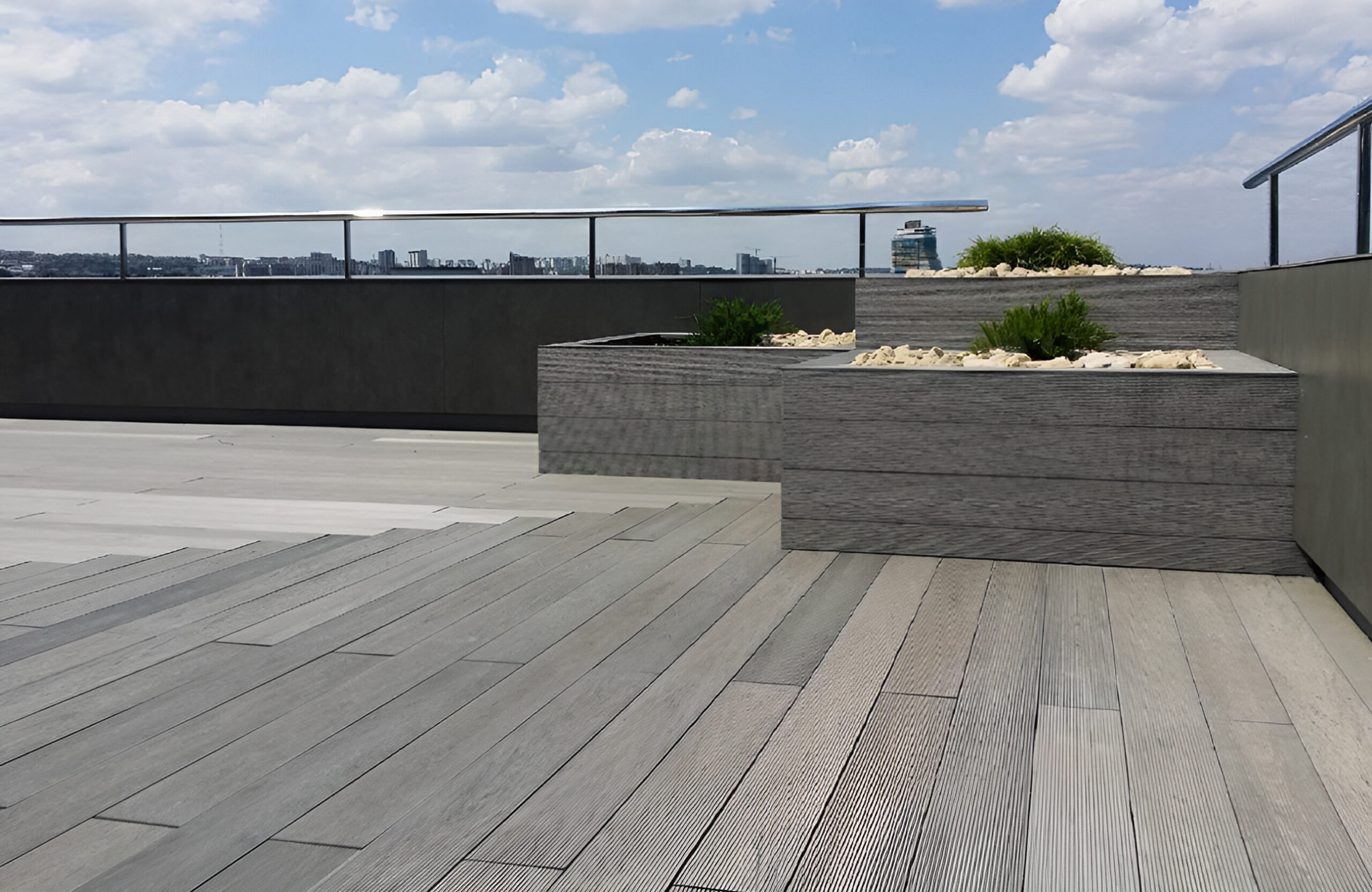 Stylish urban rooftop terrace featuring BRUGGAN Multicolor grey composite decking and modern outdoor design