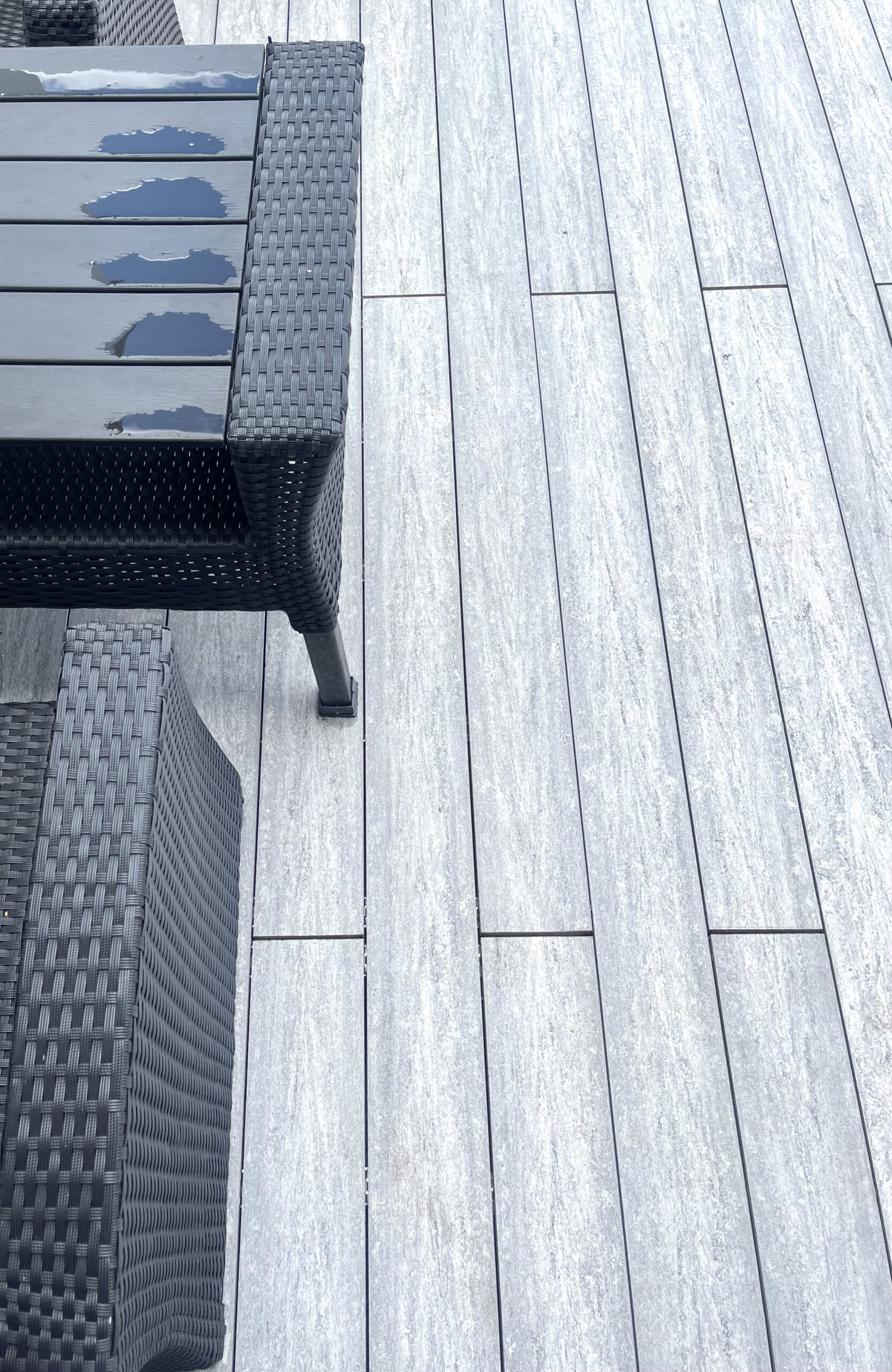 BRUGGAN MultiColor Grey composite decking on an outdoor restaurant terrace with panoramic city views