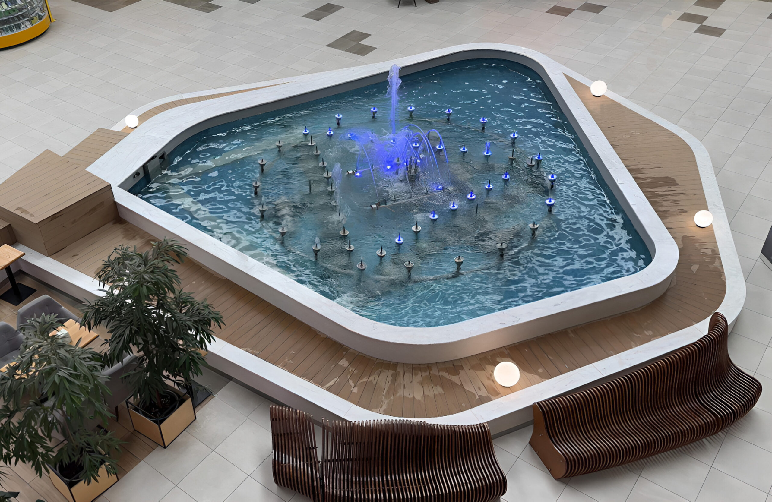 BRUGGAN Multicolor Sand WPC decking used for a curved fountain area in a shopping mall