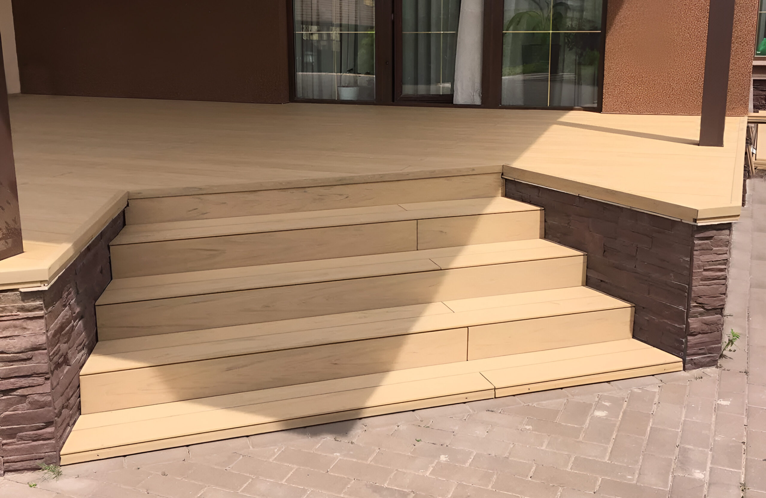 Modern outdoor terrace and stairs finished with BRUGGAN Multicolor Sand composite decking