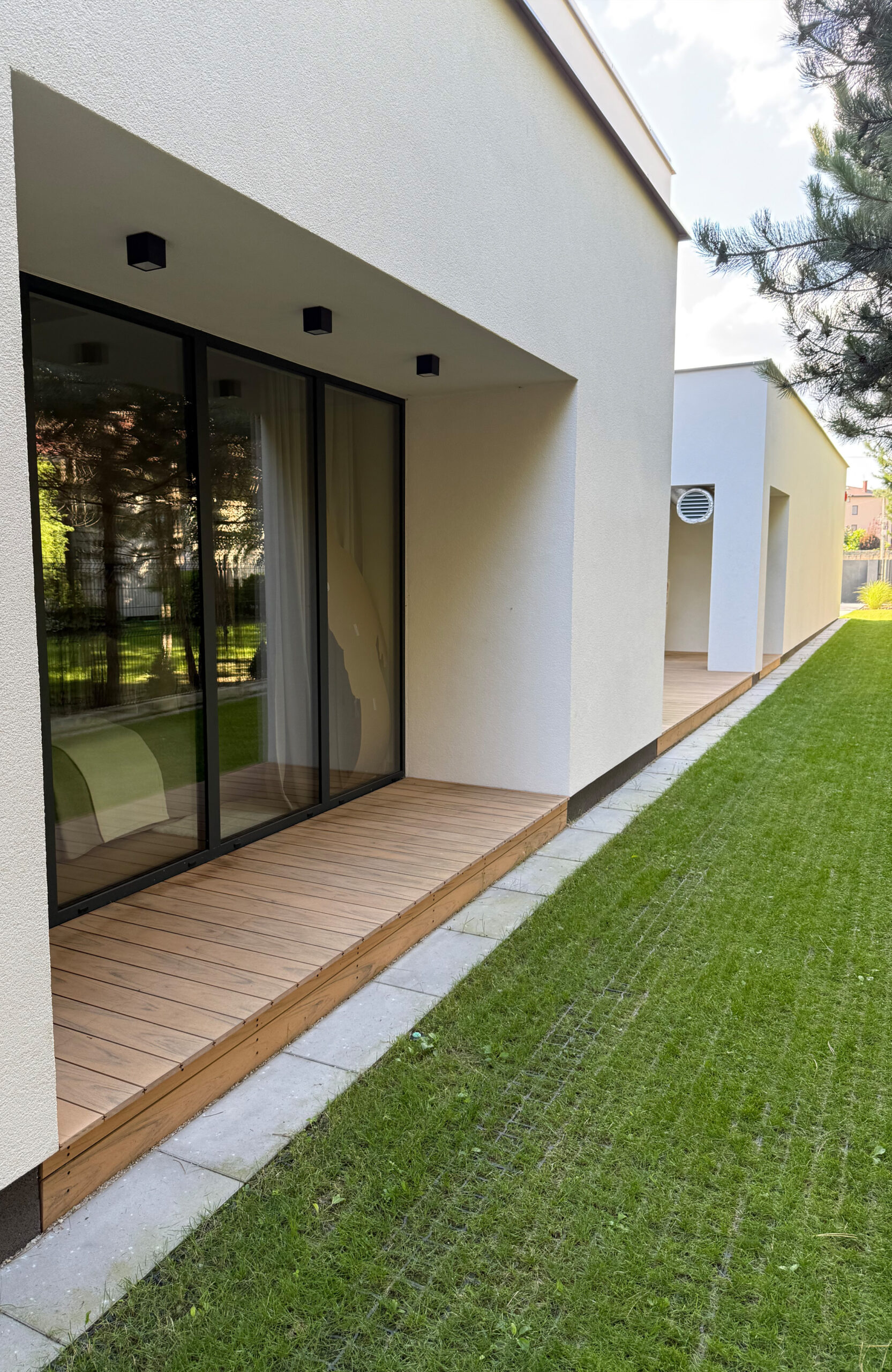 Modern outdoor terrace and pool area finished with BRUGGAN Multicolor sand decking
