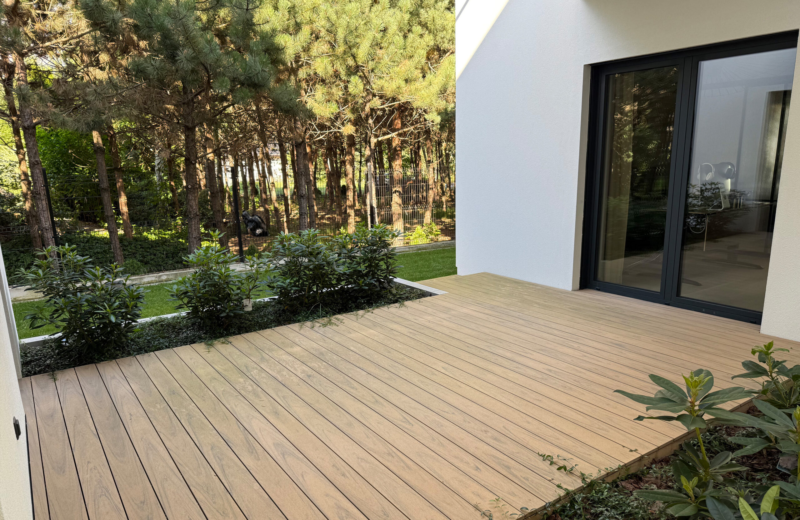 Modern outdoor terrace and pool area finished with BRUGGAN Multicolor sand decking