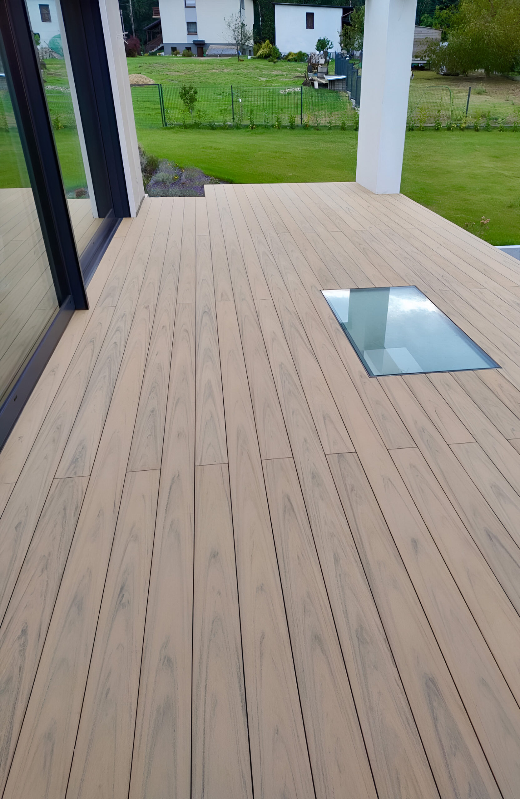 BRUGGAN Multicolor Sand WPC decking with natural wood grain on a contemporary home terrace