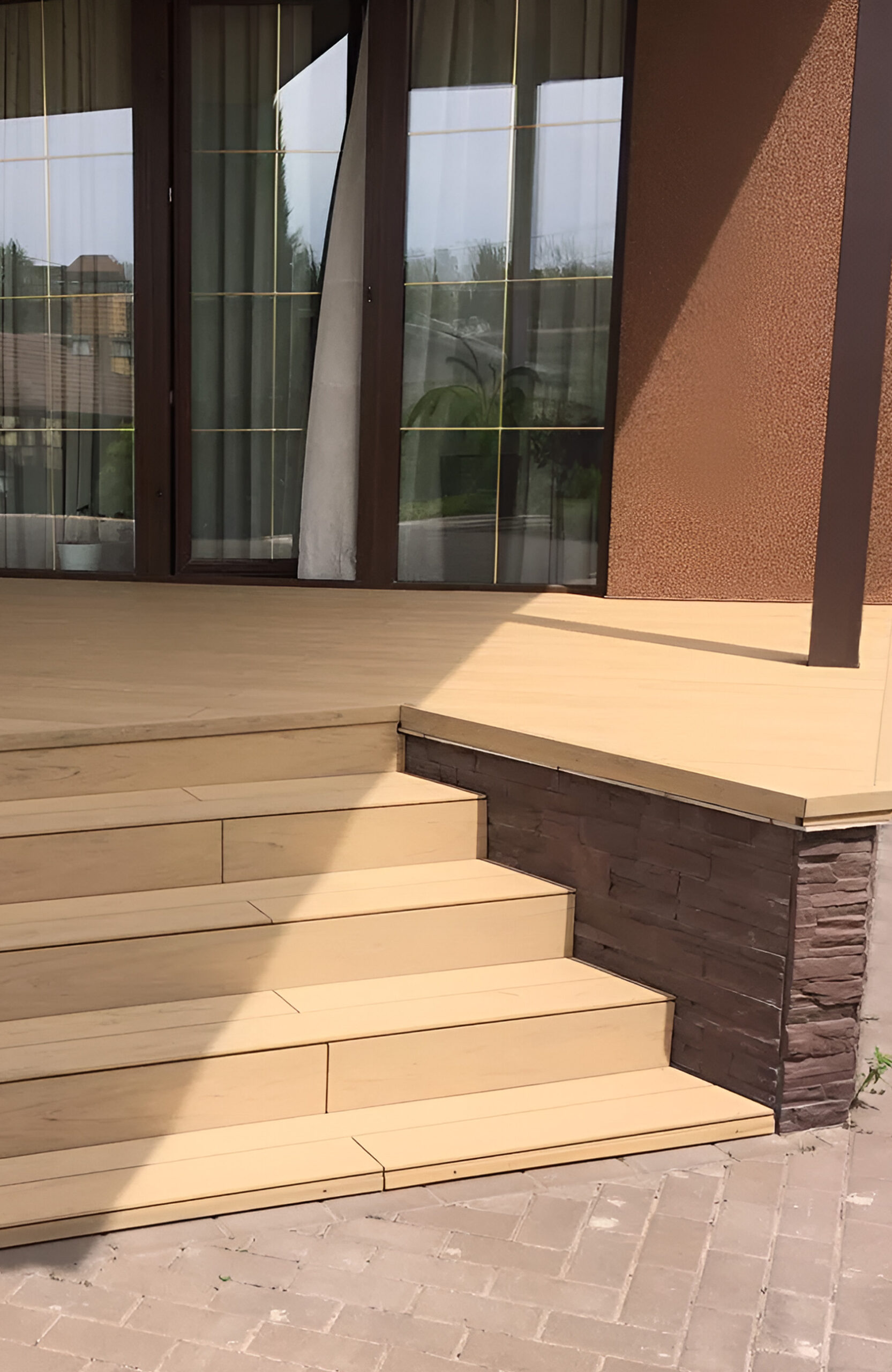 Modern outdoor terrace and stairs finished with BRUGGAN Multicolor Sand composite decking