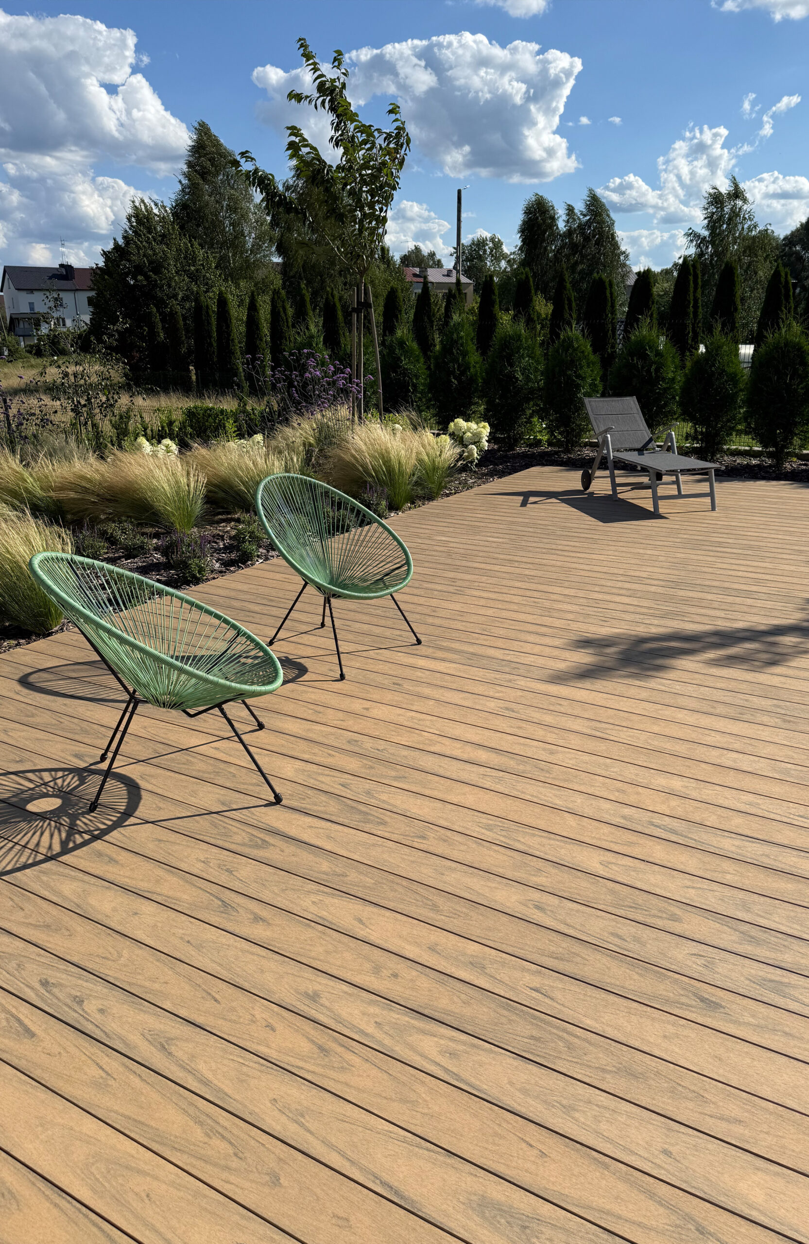 Modern outdoor terrace and pool area finished with BRUGGAN Multicolor sand decking