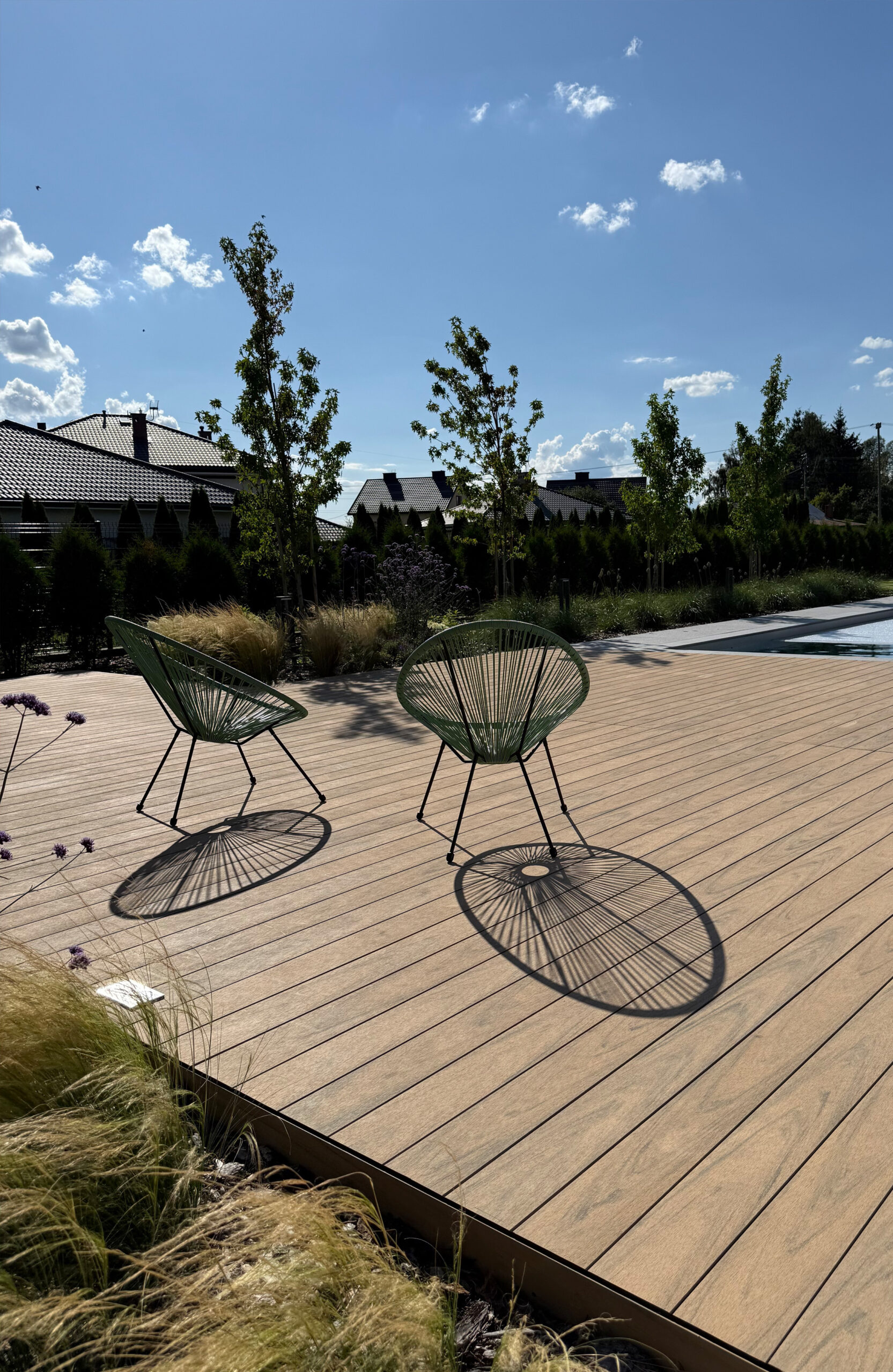 Modern outdoor terrace and pool area finished with BRUGGAN Multicolor sand decking