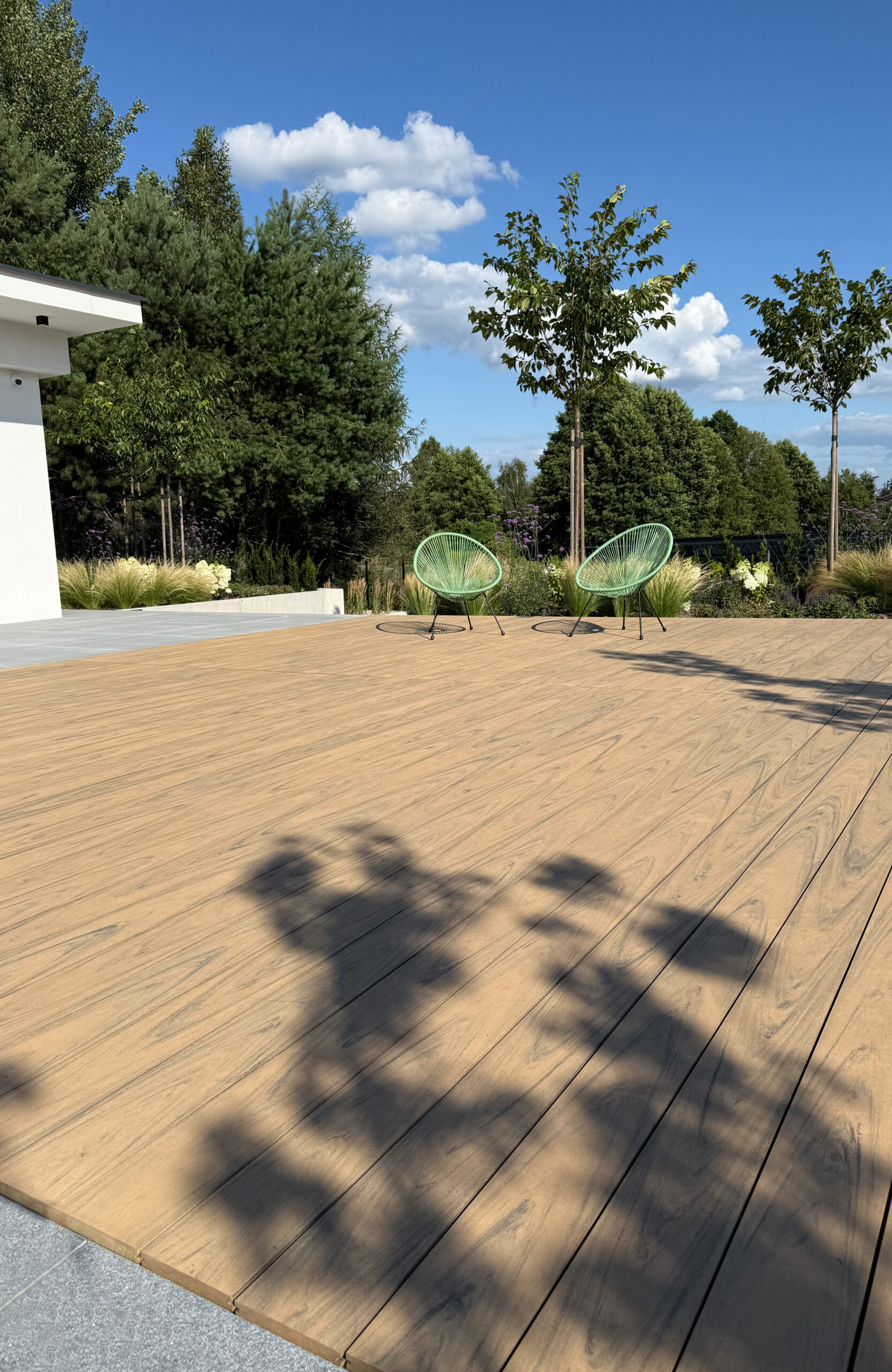 Modern outdoor terrace and pool area finished with BRUGGAN Multicolor sand decking