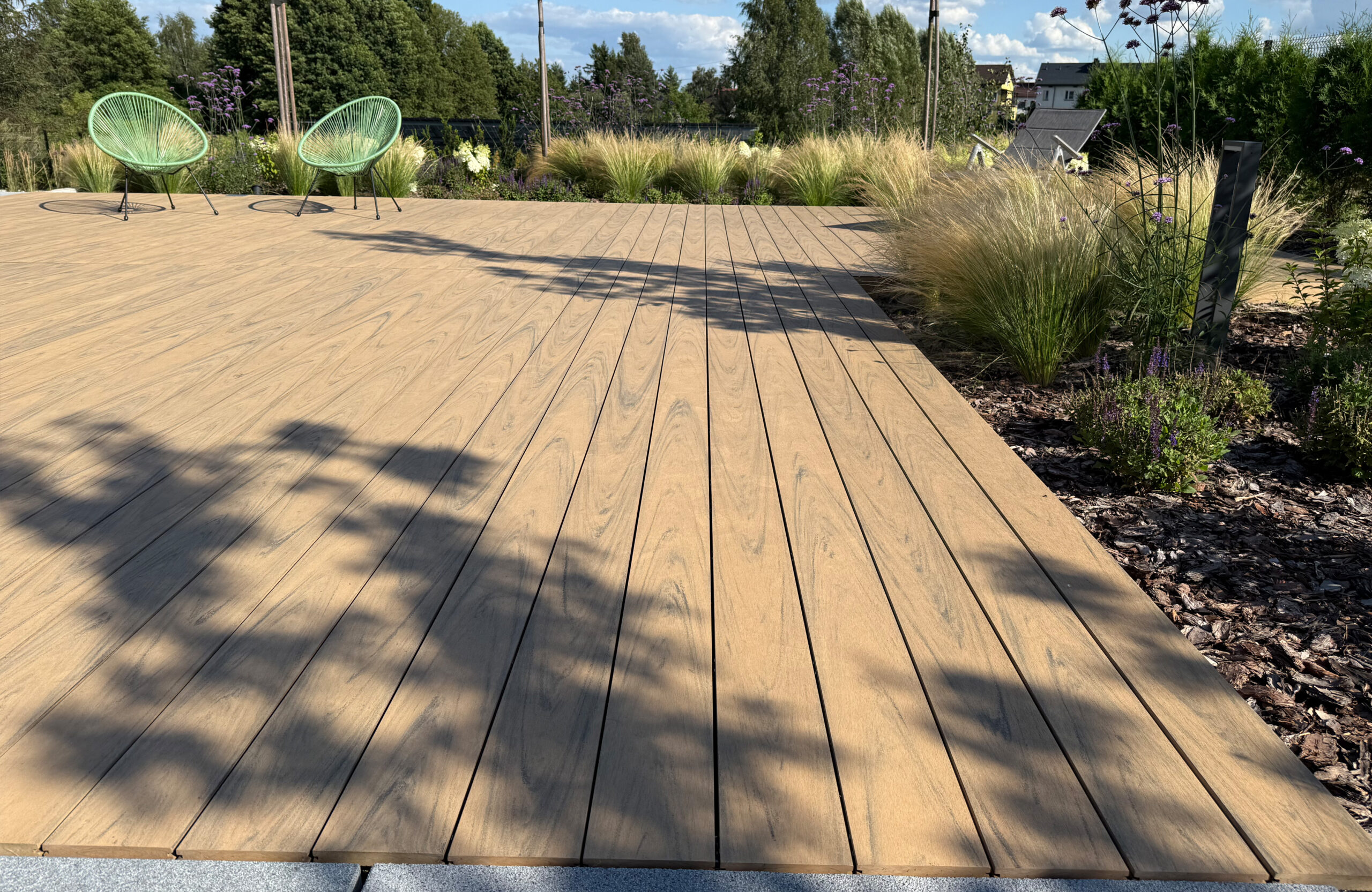 Modern outdoor terrace and pool area finished with BRUGGAN Multicolor sand decking