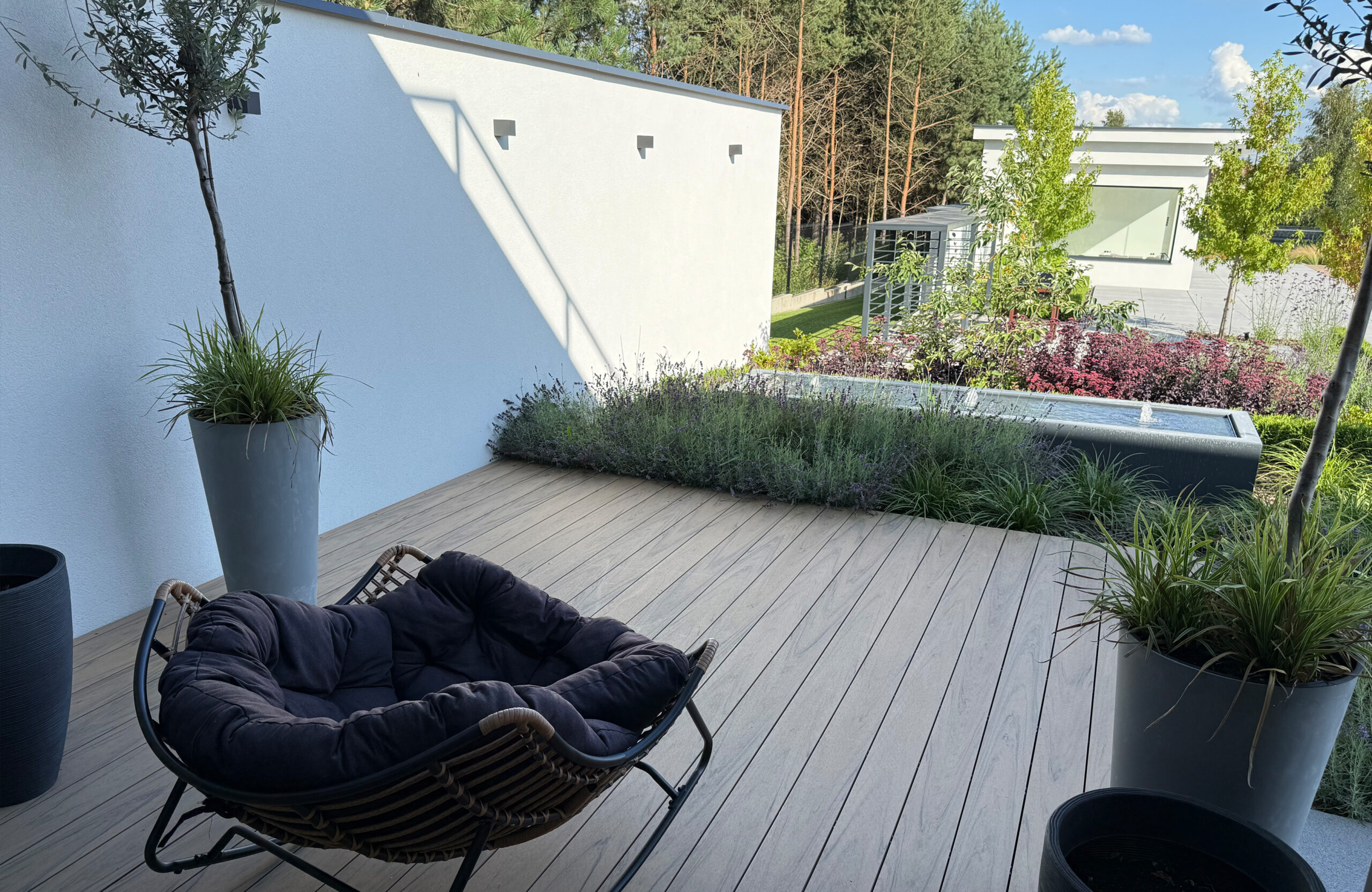 Modern outdoor terrace and pool area finished with BRUGGAN Multicolor sand decking