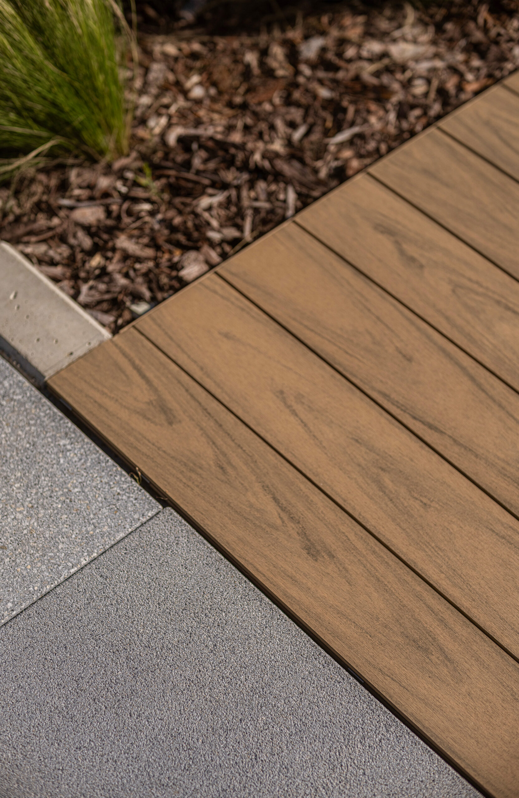 Modern outdoor terrace and pool area finished with BRUGGAN Multicolor sand decking