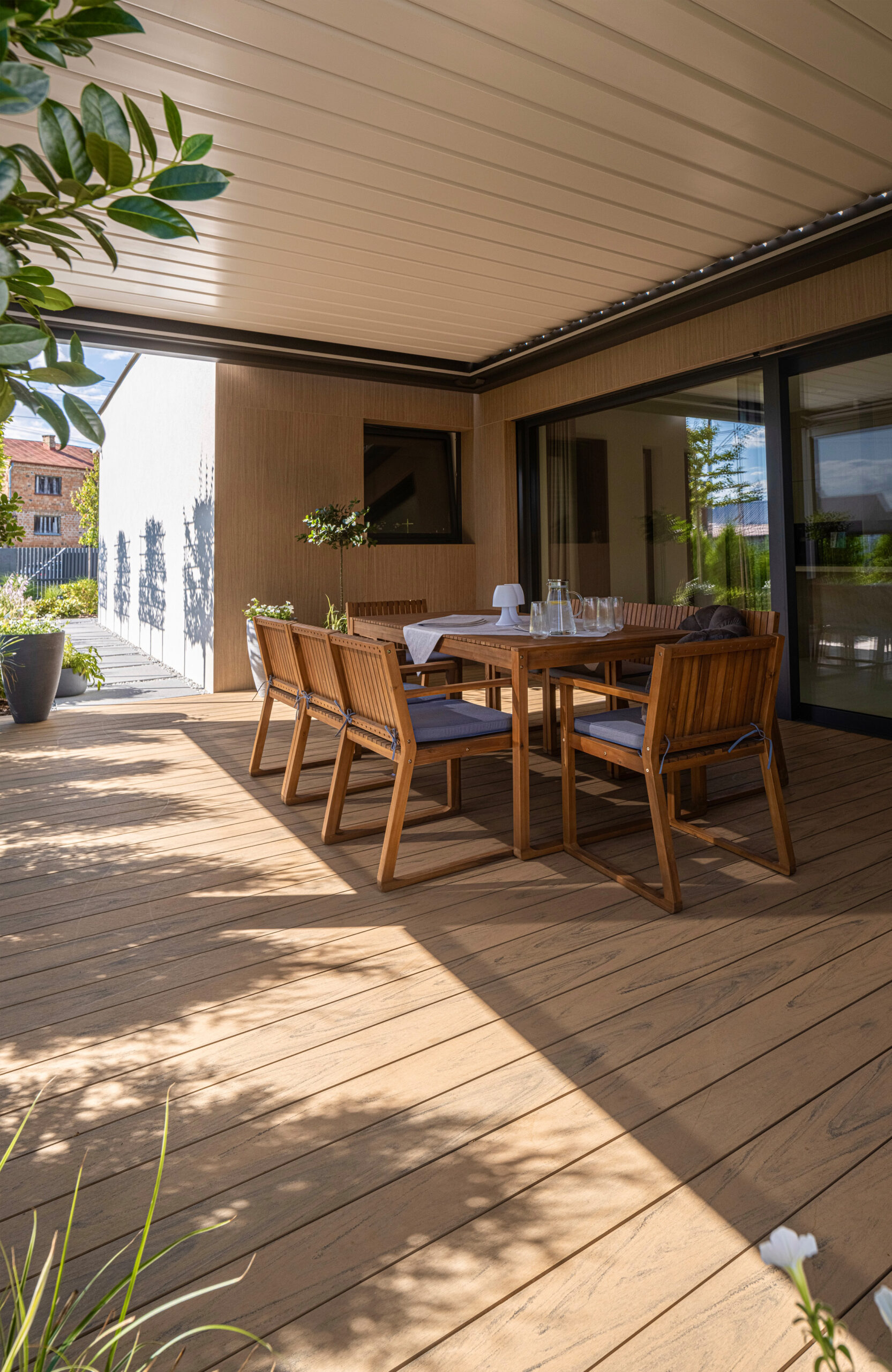 Modern outdoor terrace and pool area finished with BRUGGAN Multicolor sand decking