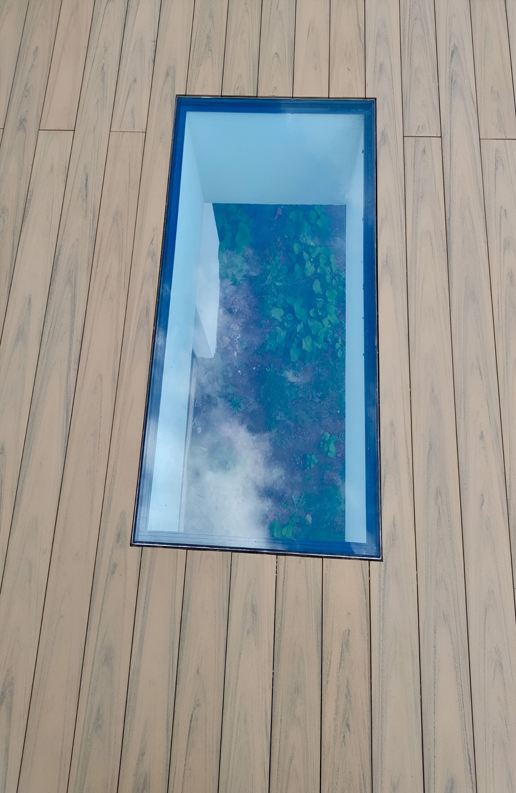 BRUGGAN Multicolor Sand WPC decking with natural wood grain on a contemporary home terrace