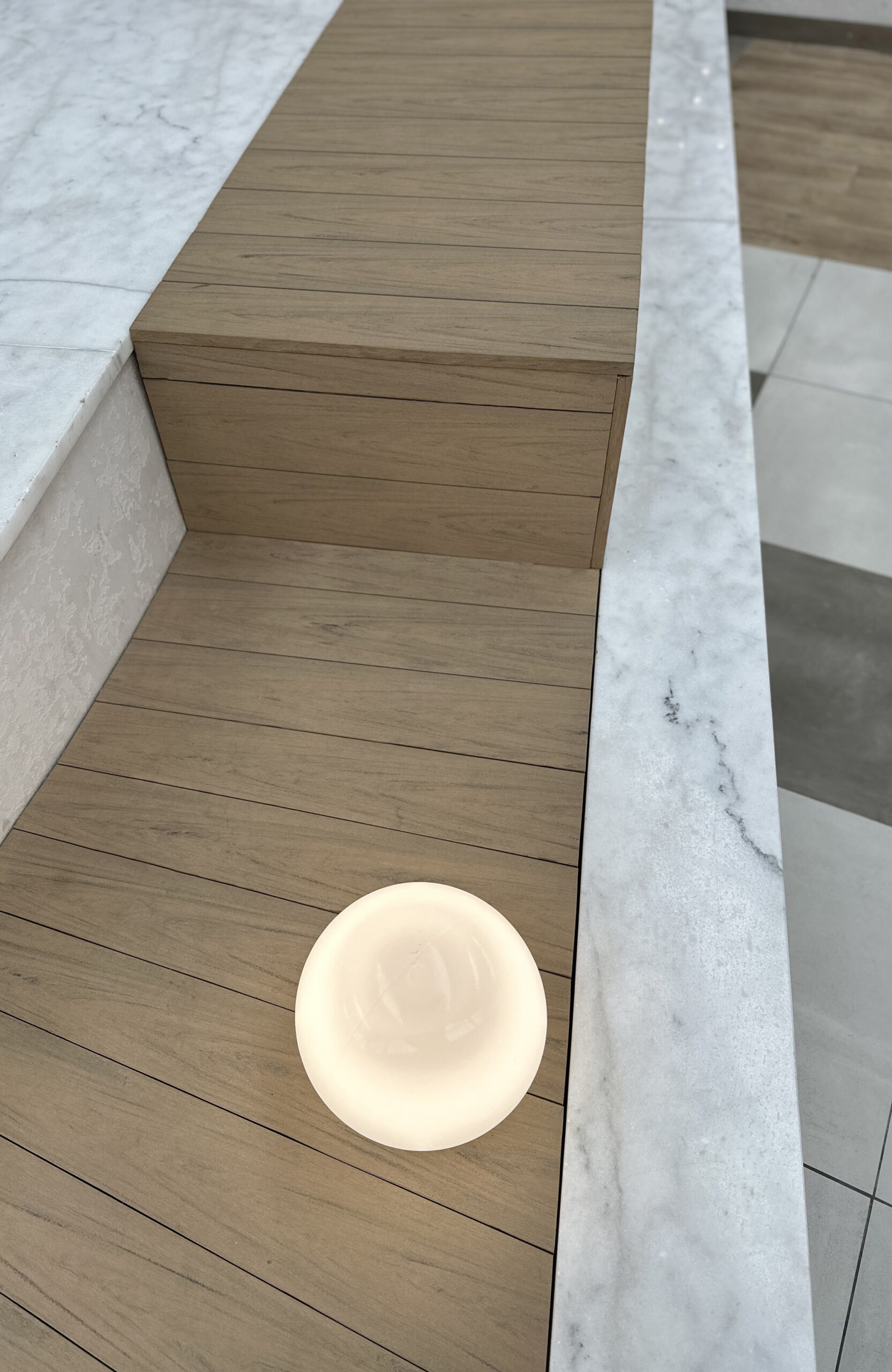 BRUGGAN Multicolor Sand WPC decking used for a curved fountain area in a shopping mall