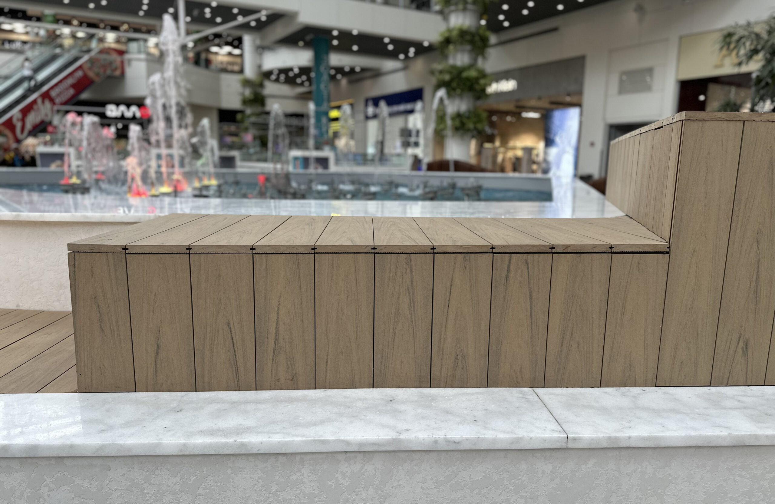 BRUGGAN Multicolor Sand WPC decking used for a curved fountain area in a shopping mall