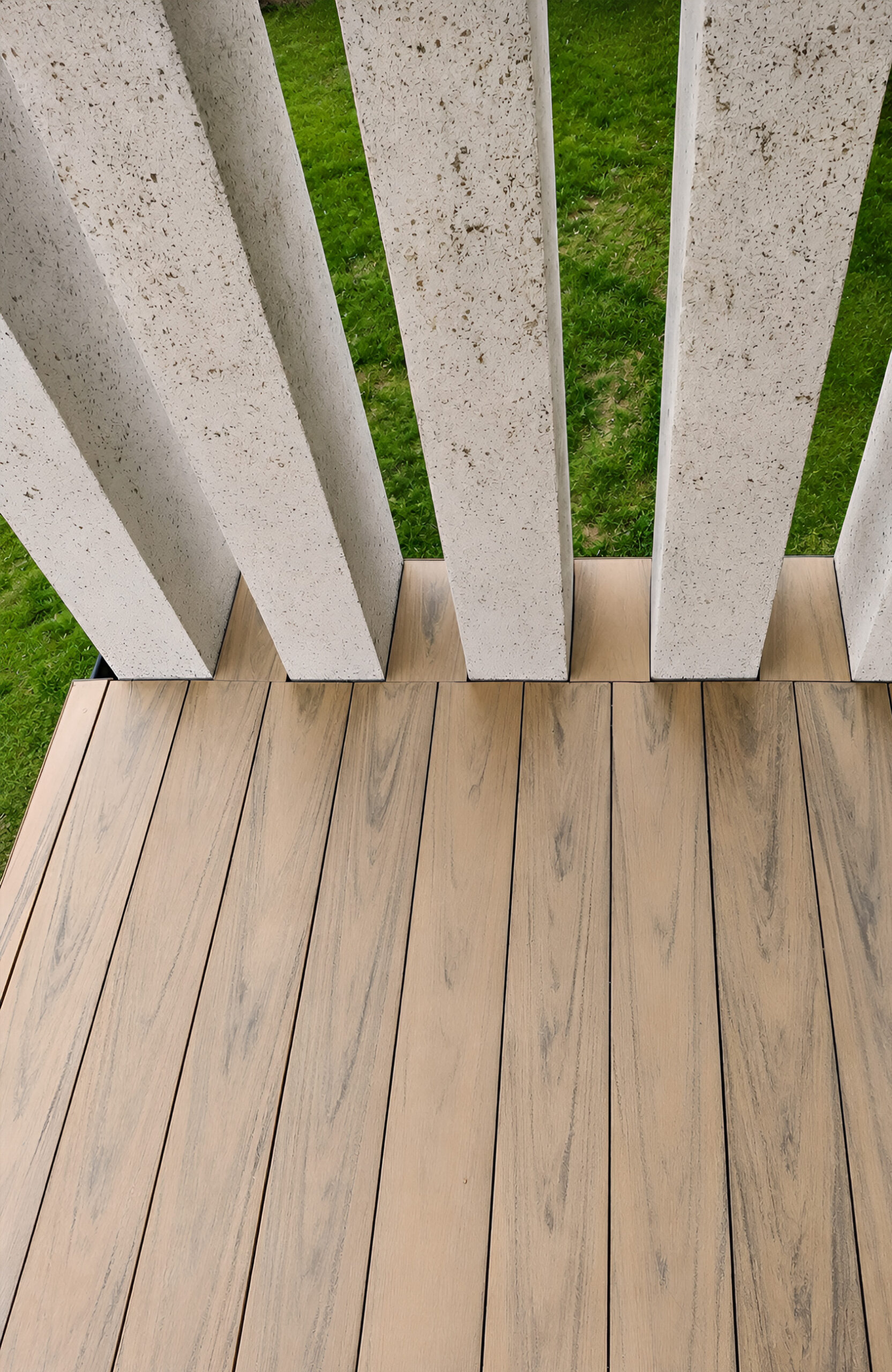 BRUGGAN Multicolor Sand WPC decking with natural wood grain on a contemporary home terrace