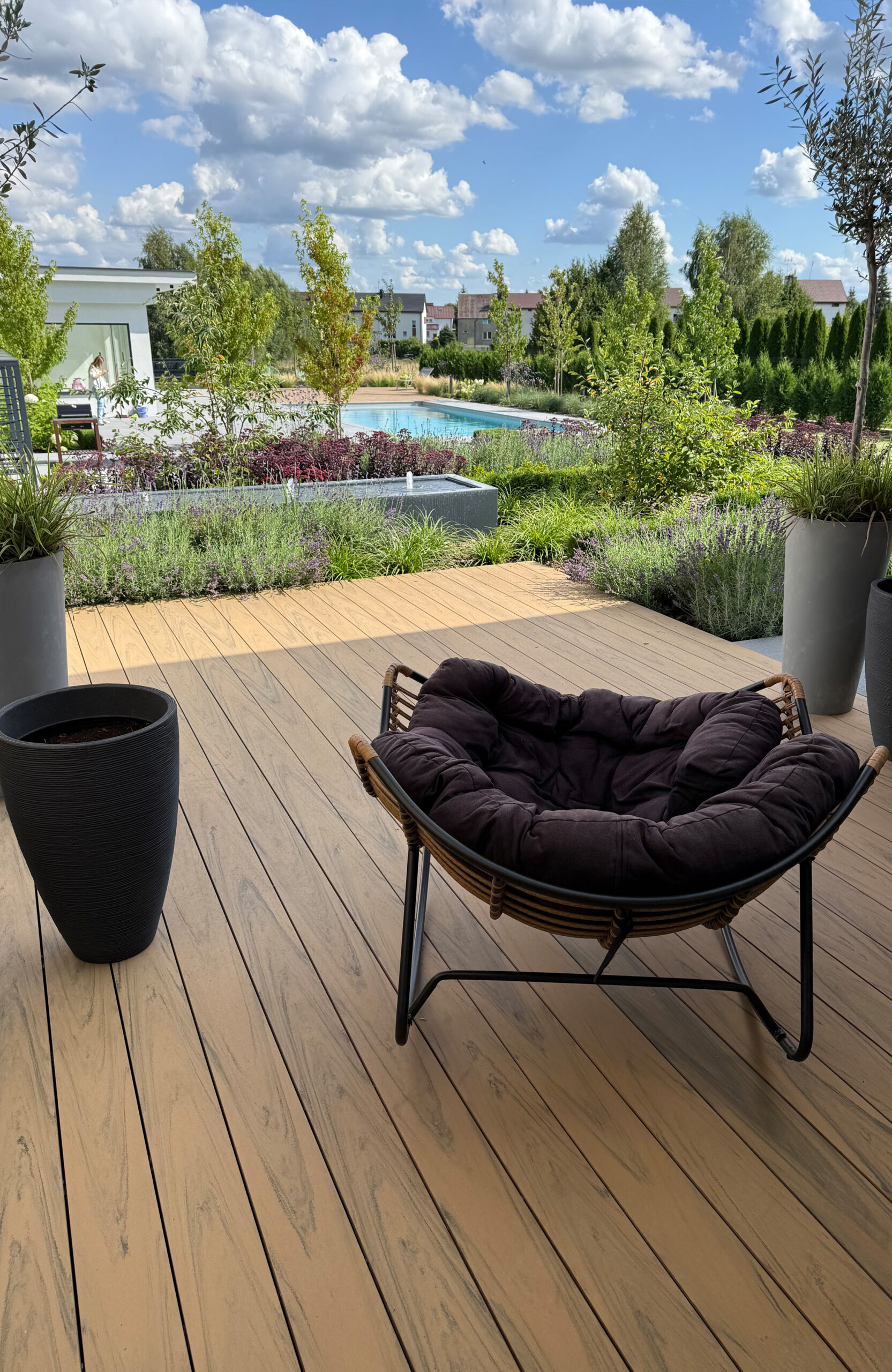 Modern outdoor terrace and pool area finished with BRUGGAN Multicolor sand decking