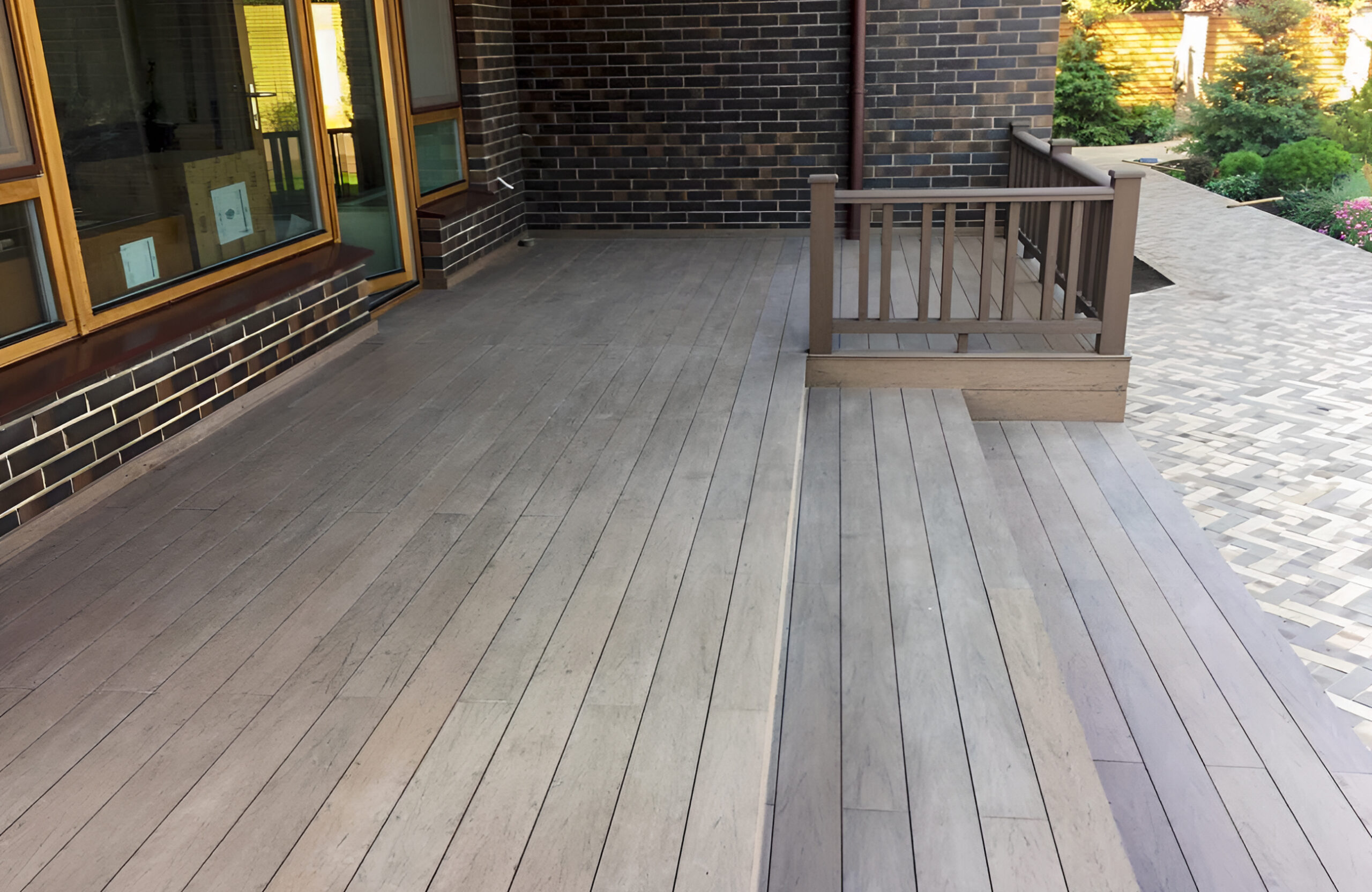 Modern outdoor terrace with Wenge WPC decking and matching railing