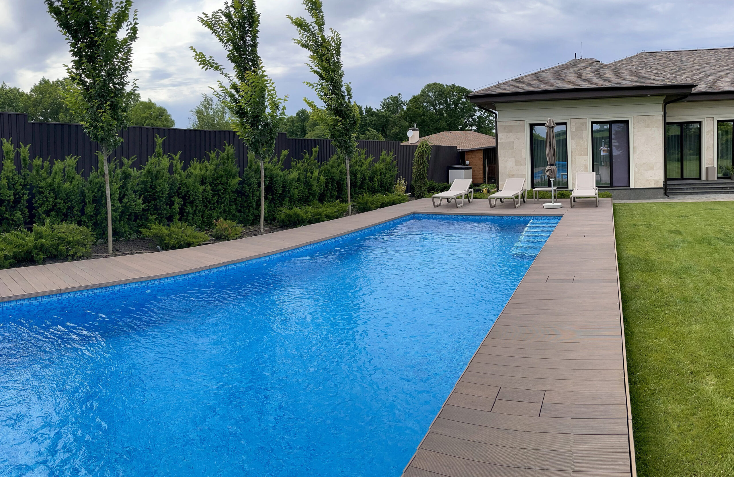 Poolside terrace with BRUGGAN Multicolor Wenge composite decking