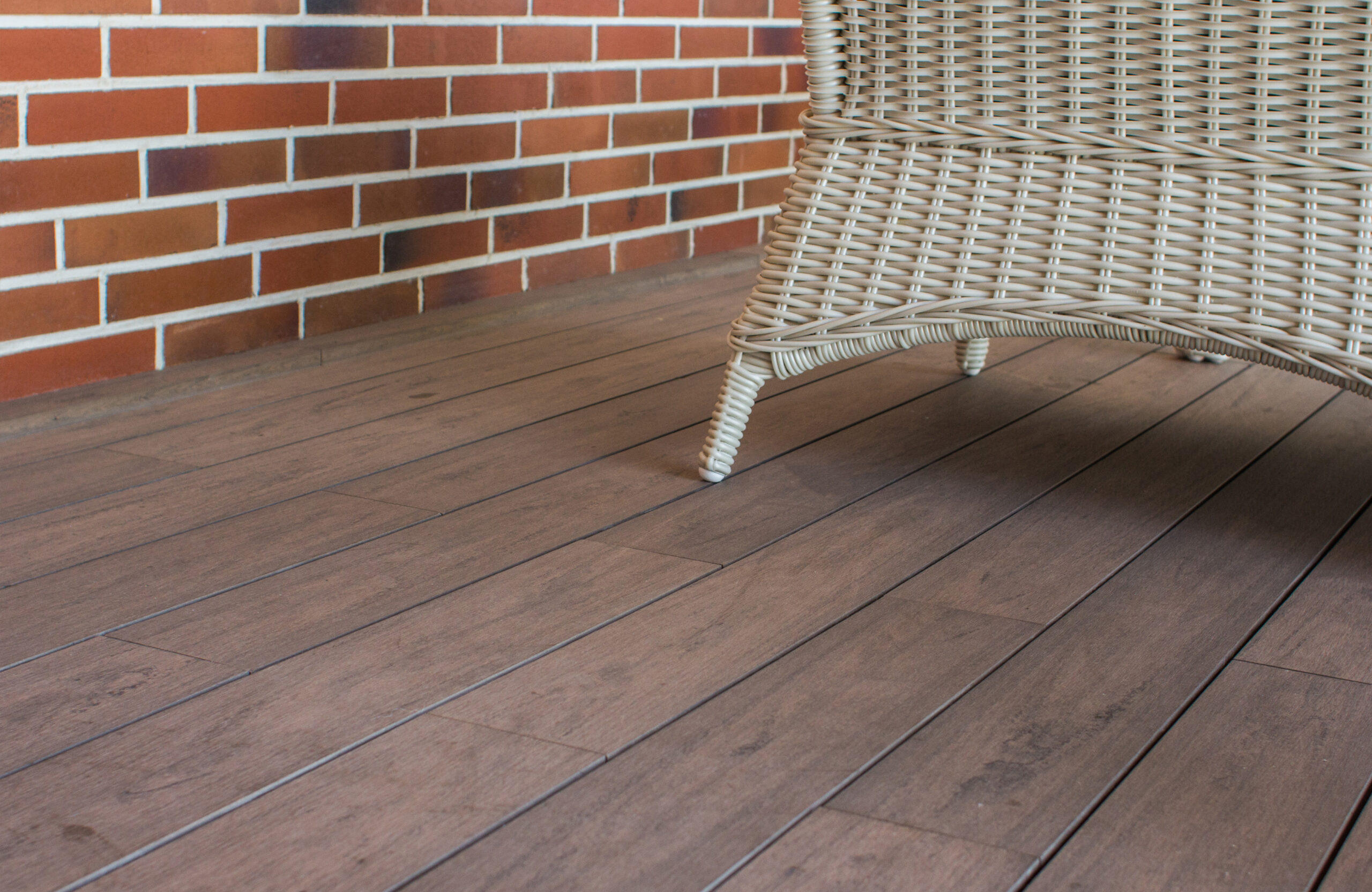 BRUGGAN Multicolor Wenge terrace boards with natural wood texture and wicker furniture