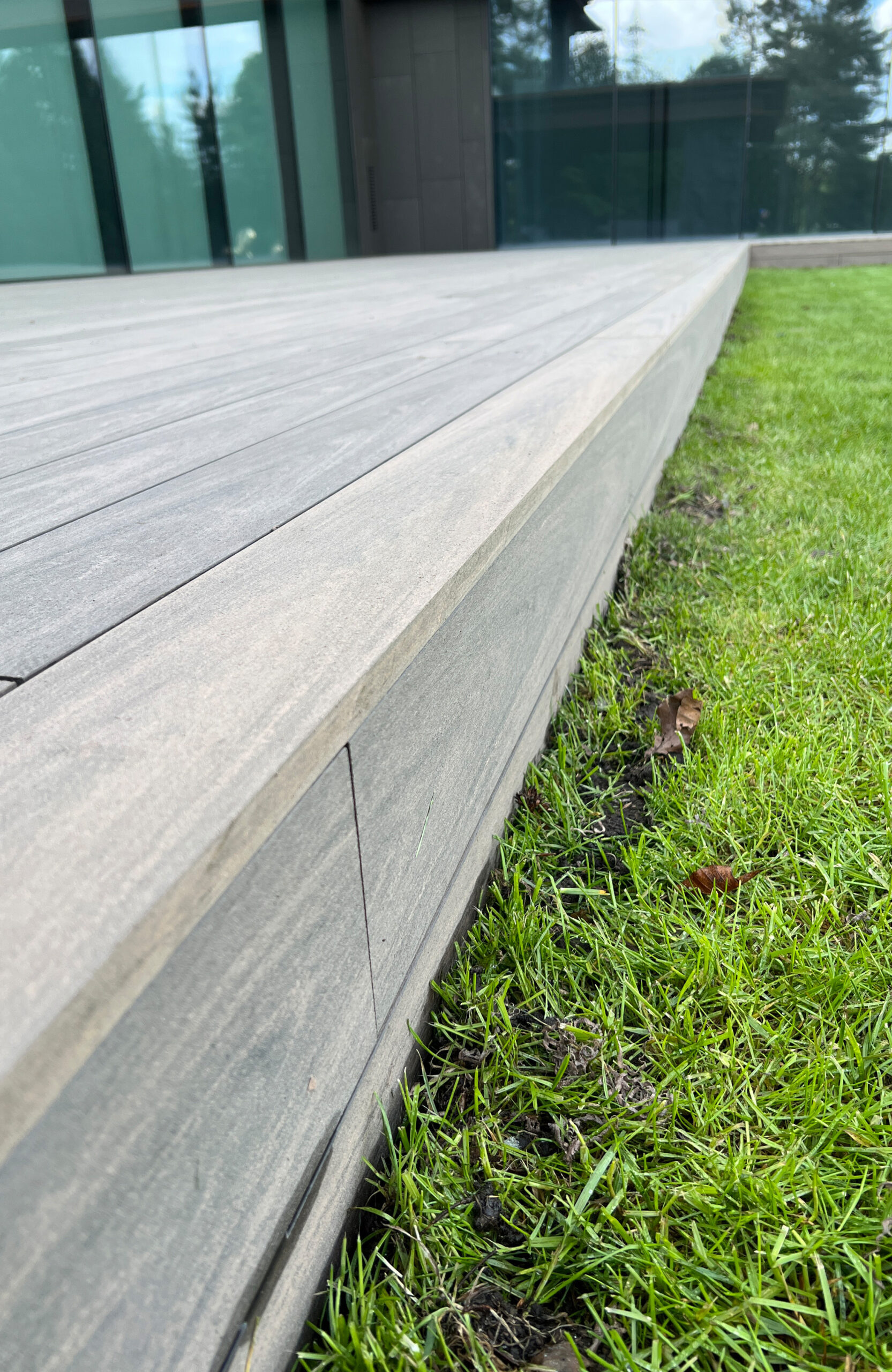 BRUGGAN Multicolor Wenge decking around a modern villa with landscaped garden in Kyiv