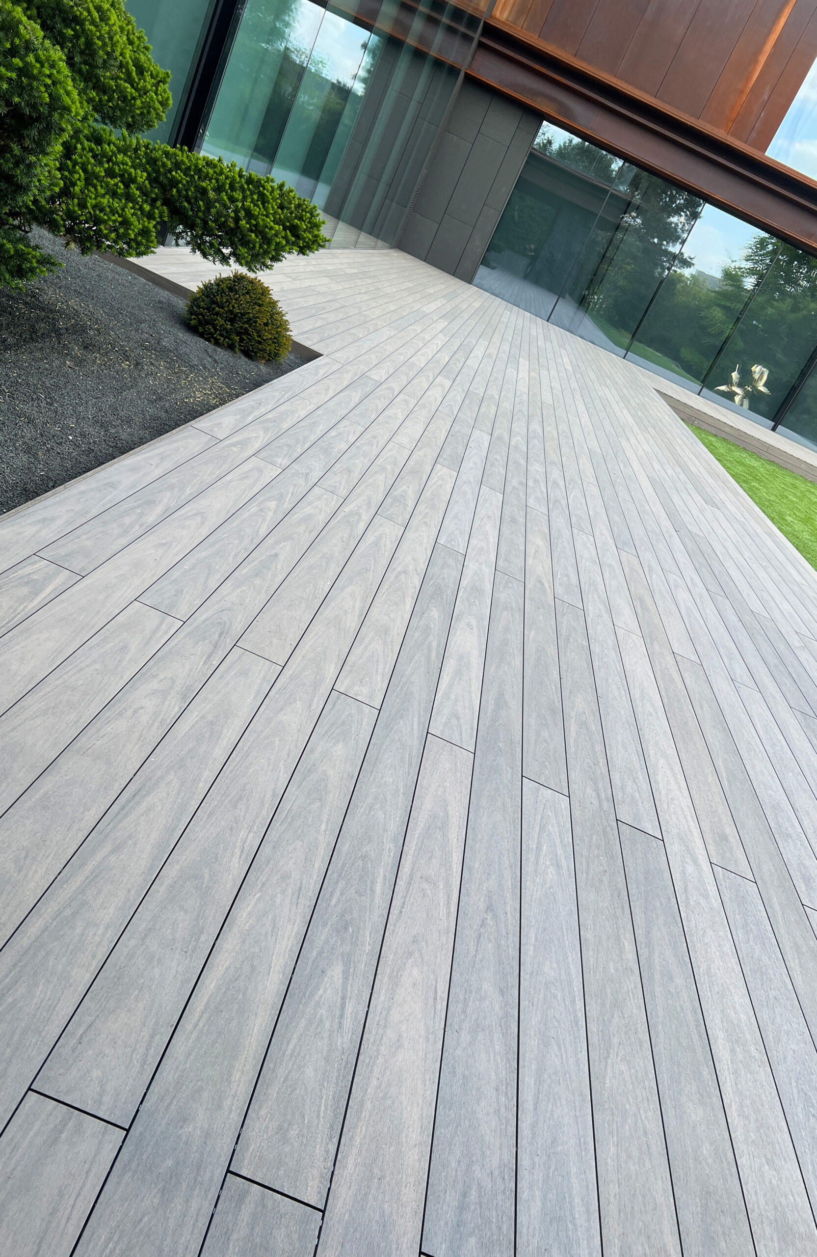 BRUGGAN Multicolor Wenge decking around a modern villa with landscaped garden in Kyiv
