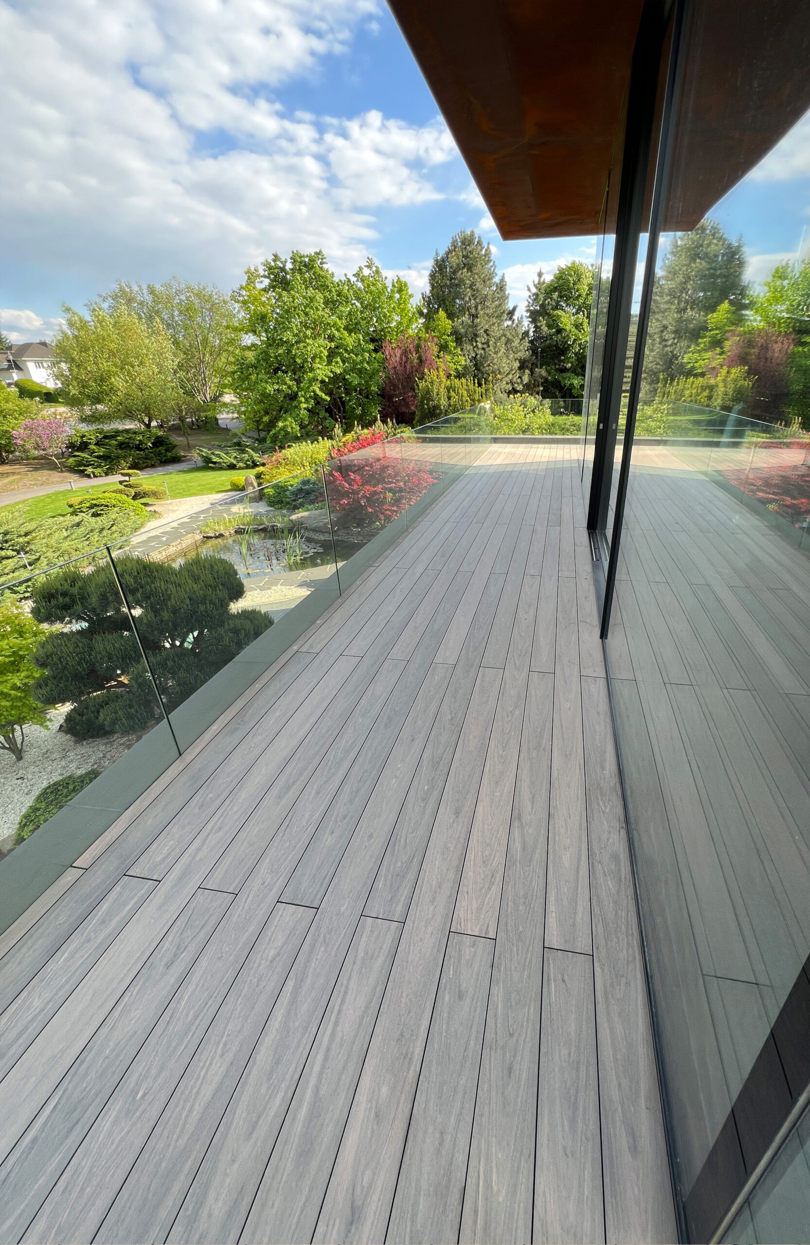 BRUGGAN Multicolor Wenge decking around a modern villa with landscaped garden in Kyiv