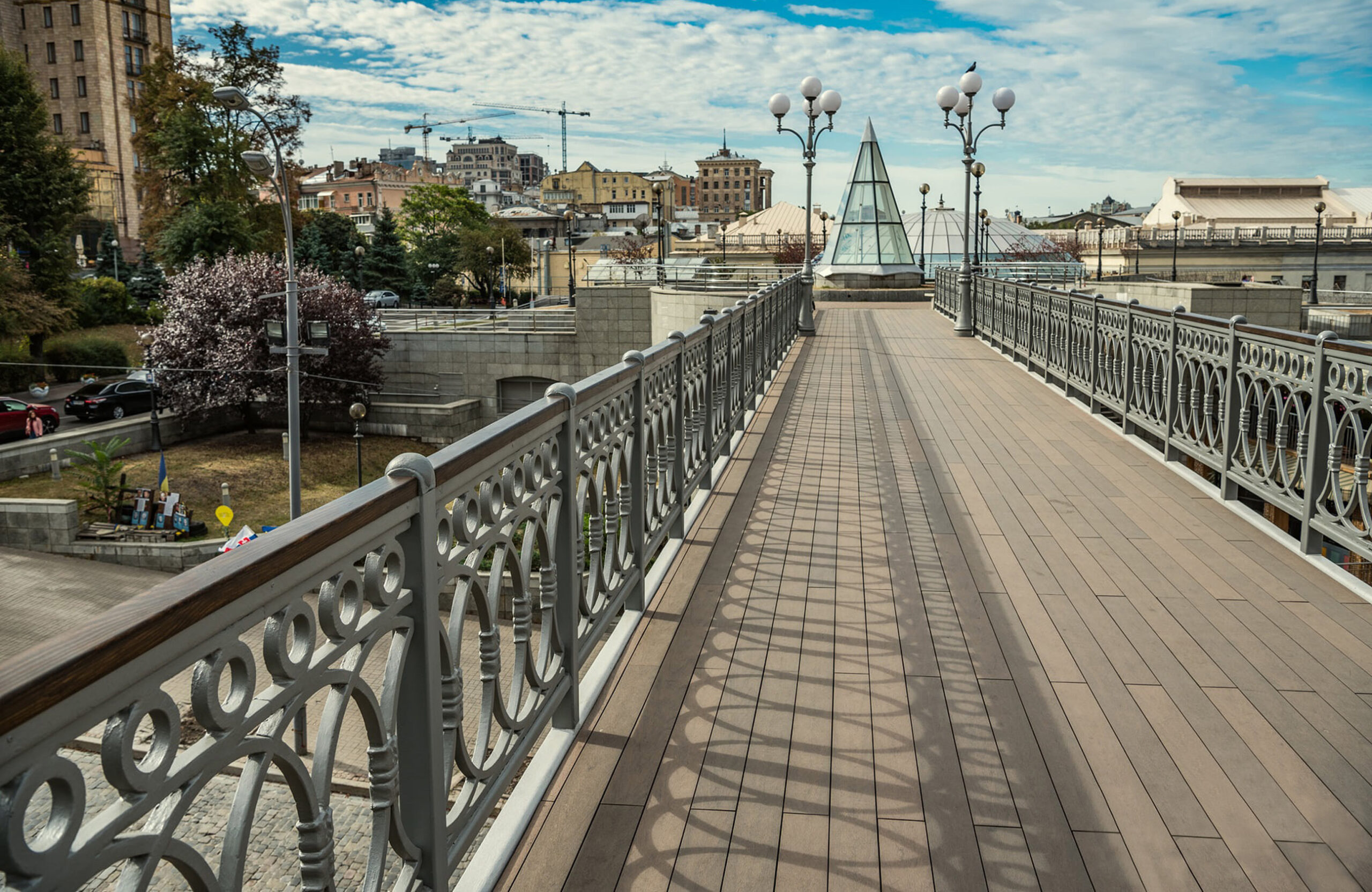 BRUGGAN Multicolor Wenge composite decking on a pedestrian bridge in Kyiv, Ukraine