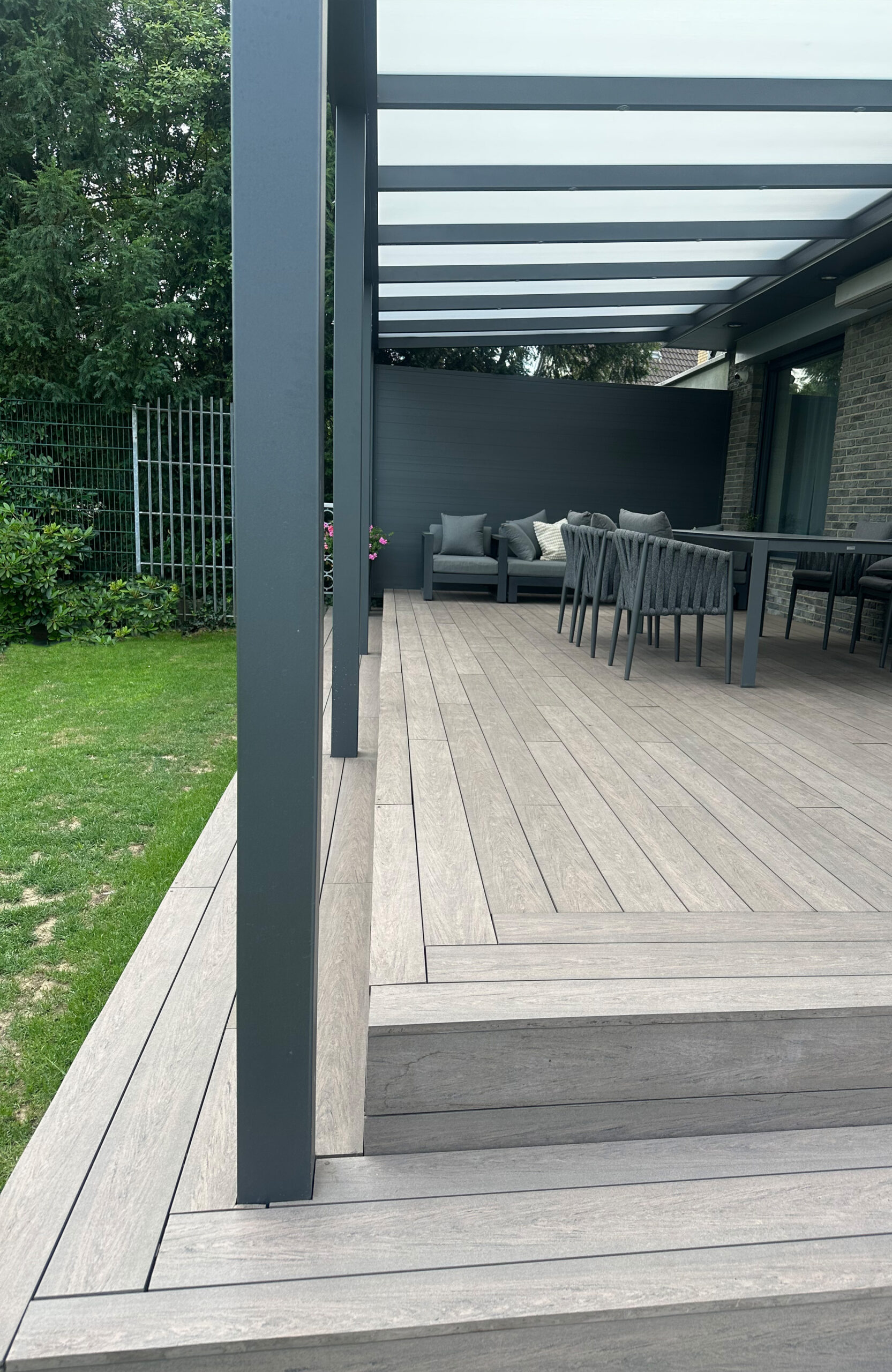 BRUGGAN Multicolor Wenge terrace decking with steps and stylish outdoor lounge area