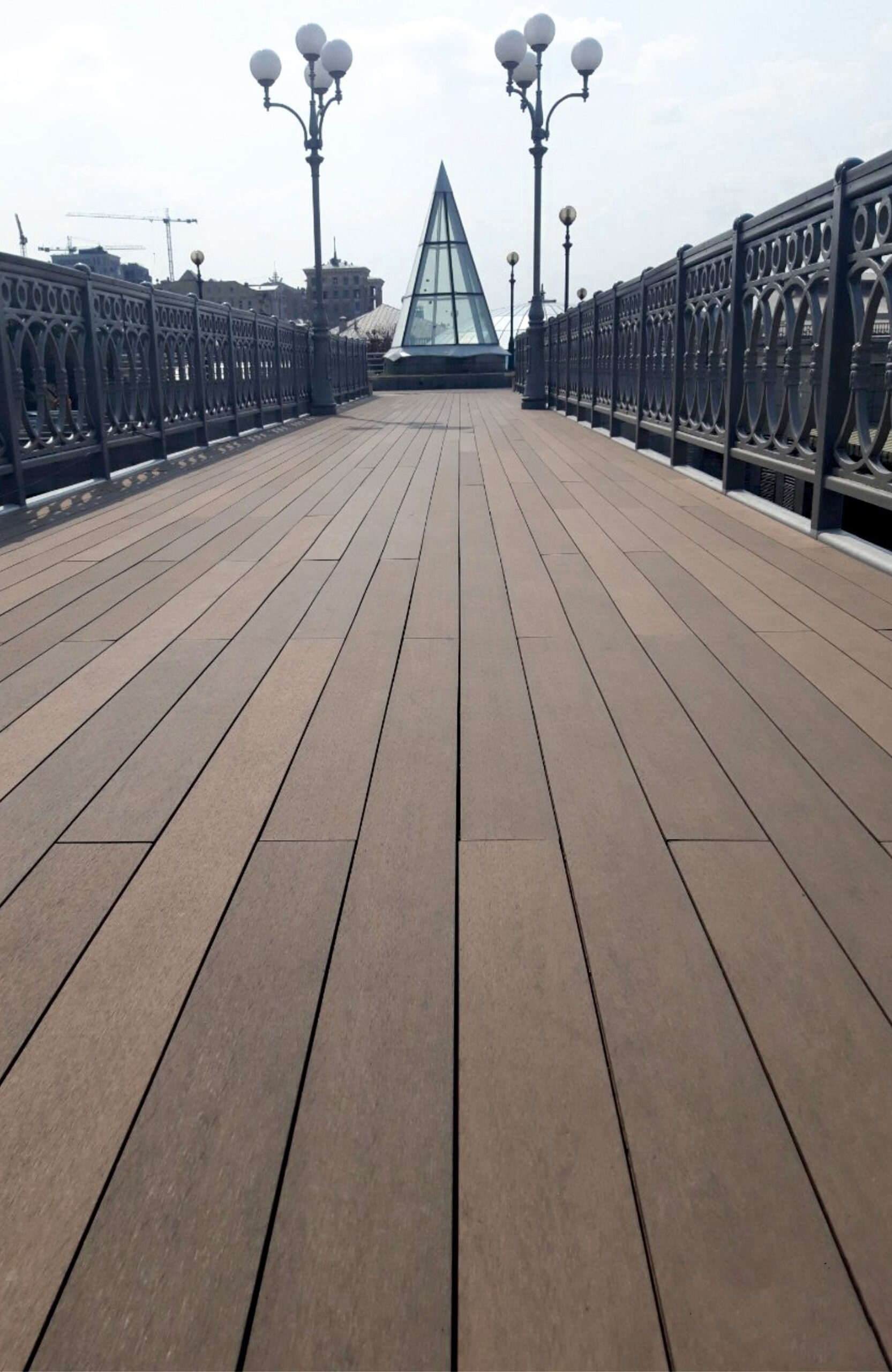 BRUGGAN Multicolor Wenge composite decking on a pedestrian bridge in Kyiv, Ukraine