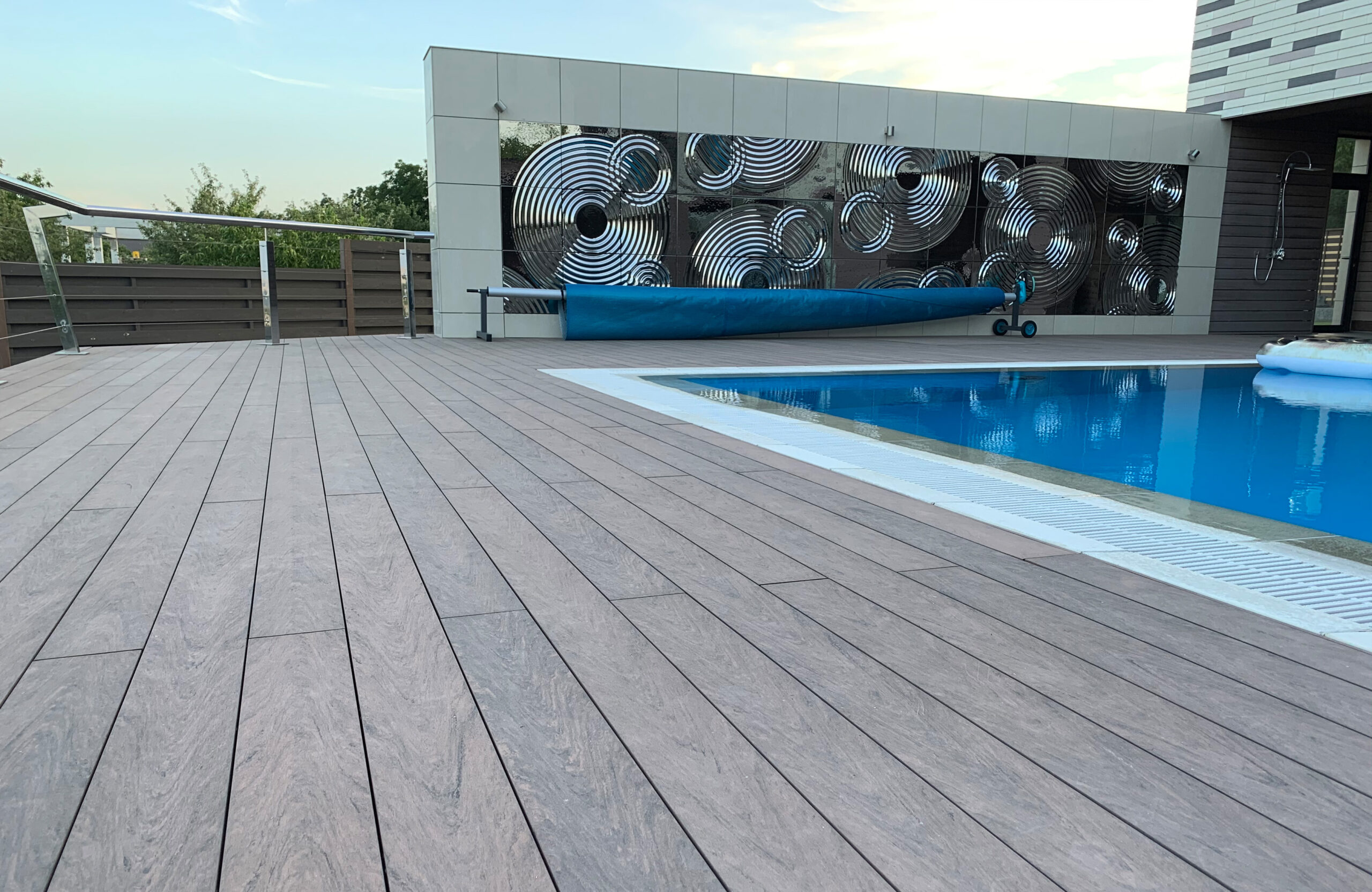 Modern pool terrace finished with BRUGGAN Multicolor Wenge decking at a private residence