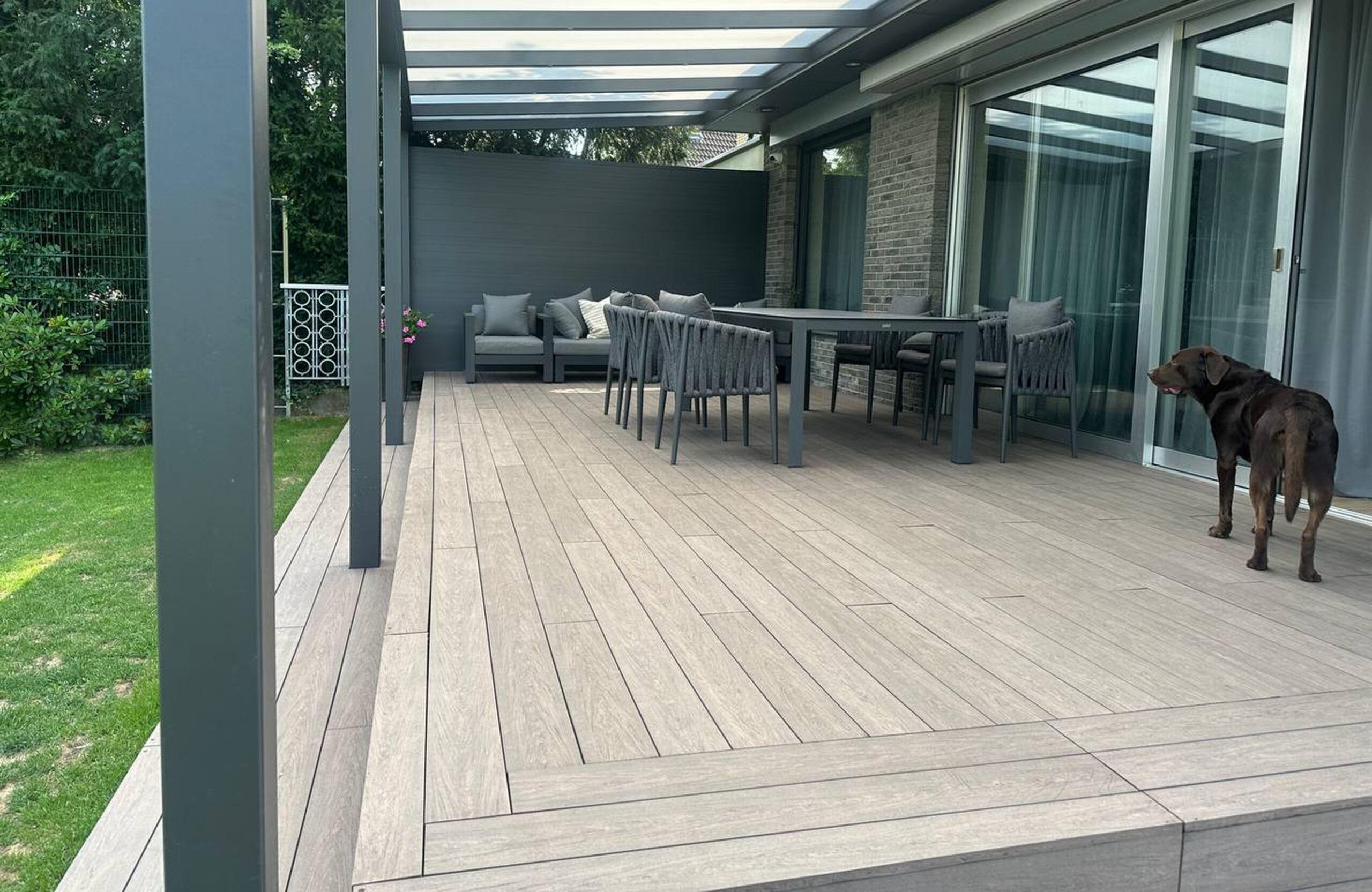 Modern garden terrace with pergola and BRUGGAN Multicolor Wenge decking boards