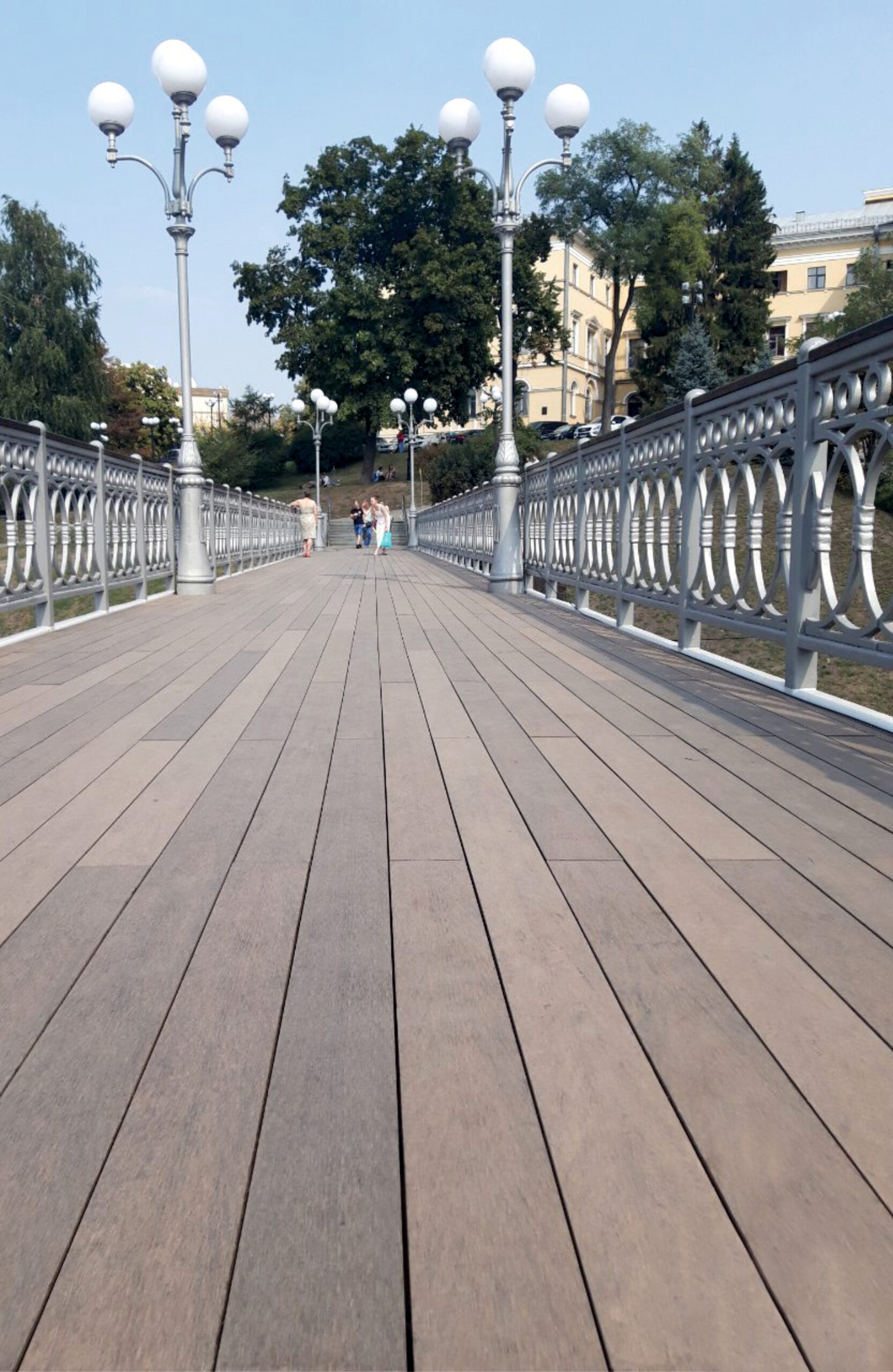 BRUGGAN Multicolor Wenge composite decking on a pedestrian bridge in Kyiv, Ukraine