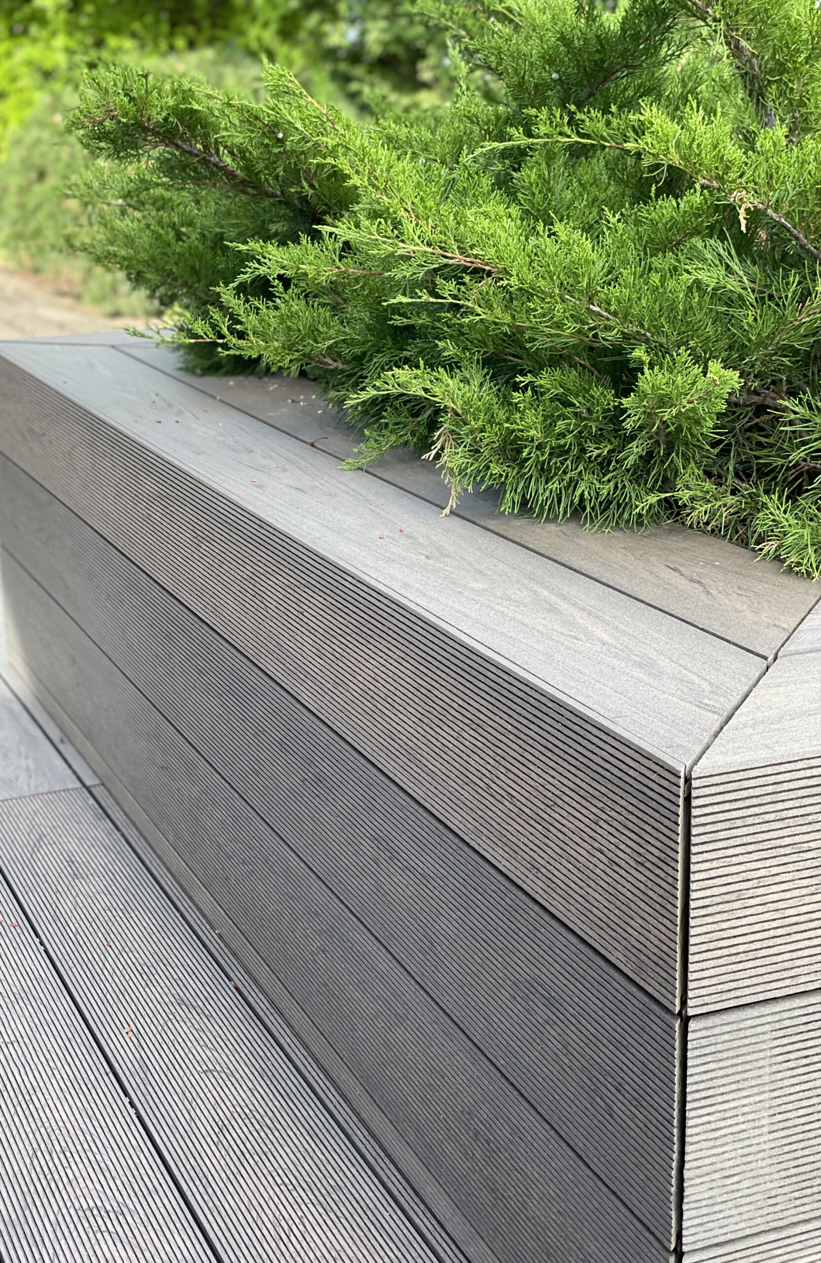 Rooftop landscape park in Kyiv with BRUGGAN Multicolor Wenge composite decking and integrated planters