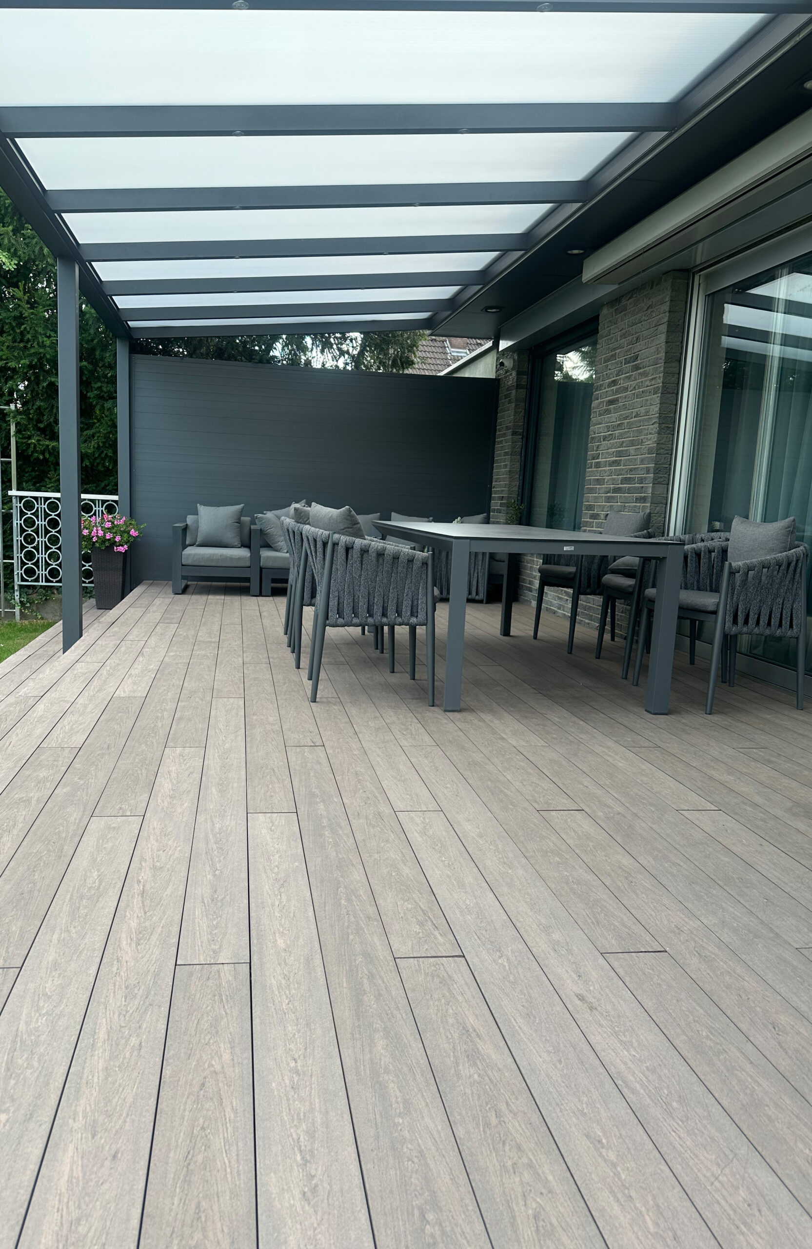 Modern garden terrace with pergola and BRUGGAN Multicolor Wenge decking boards
