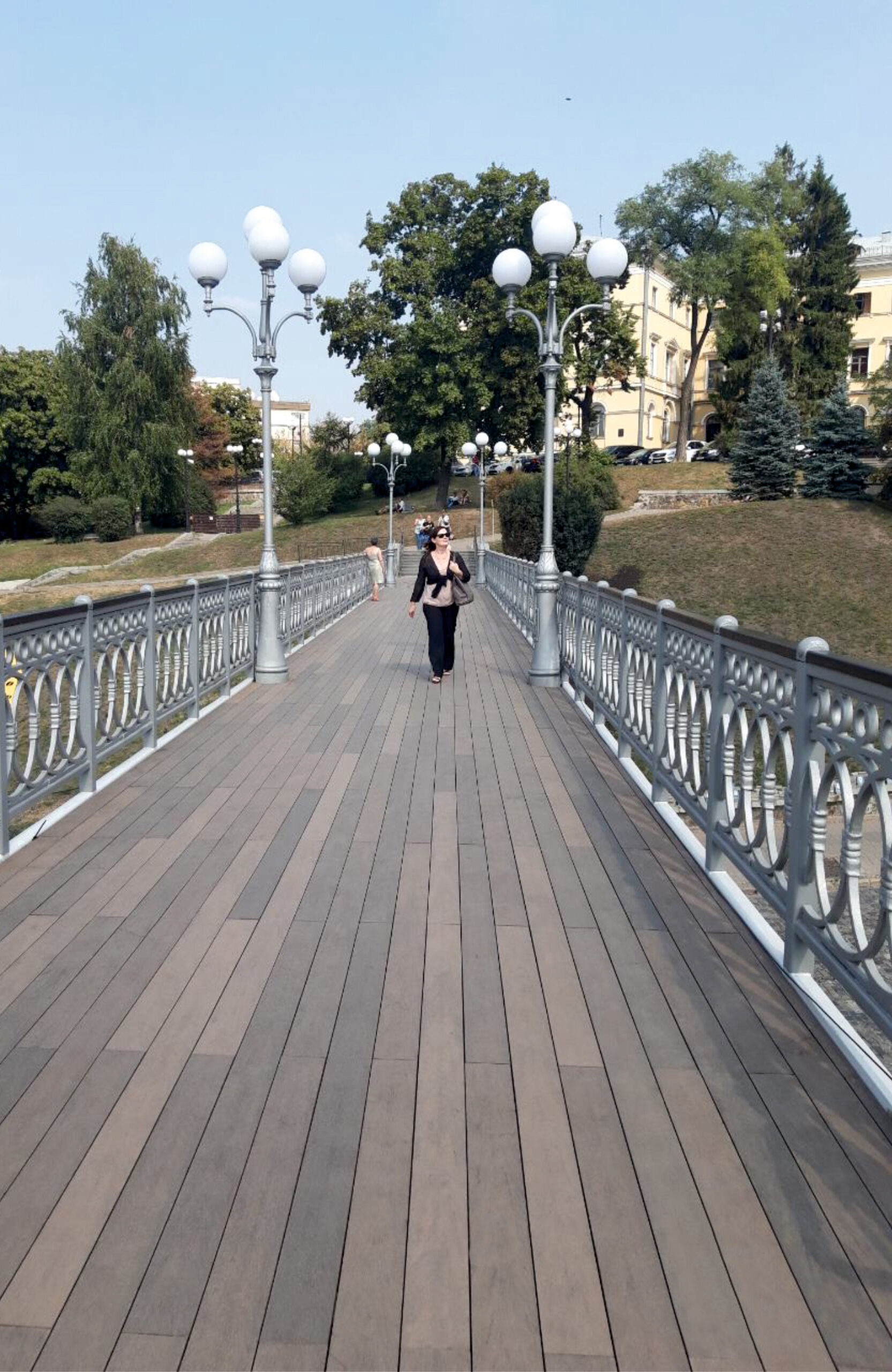 BRUGGAN Multicolor Wenge composite decking on a pedestrian bridge in Kyiv, Ukraine